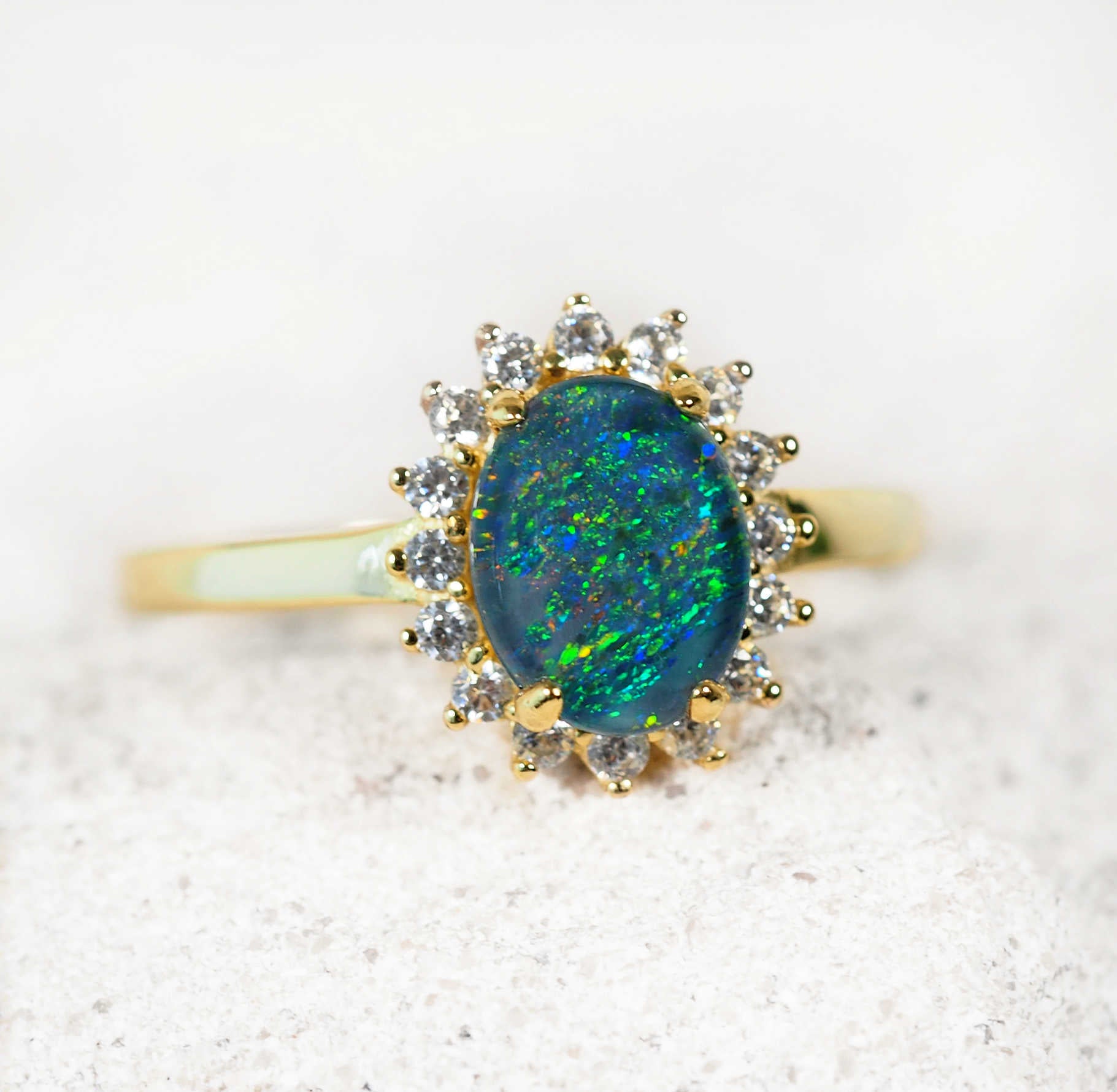 blue and green opal ring set in gold plated silver with diamantes