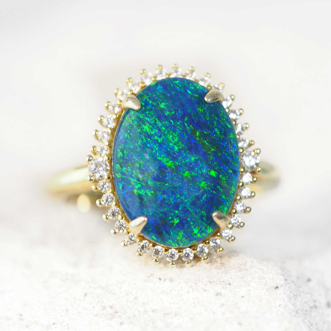 Blue and green opal ring set with 34 diamantes in gold plated silver