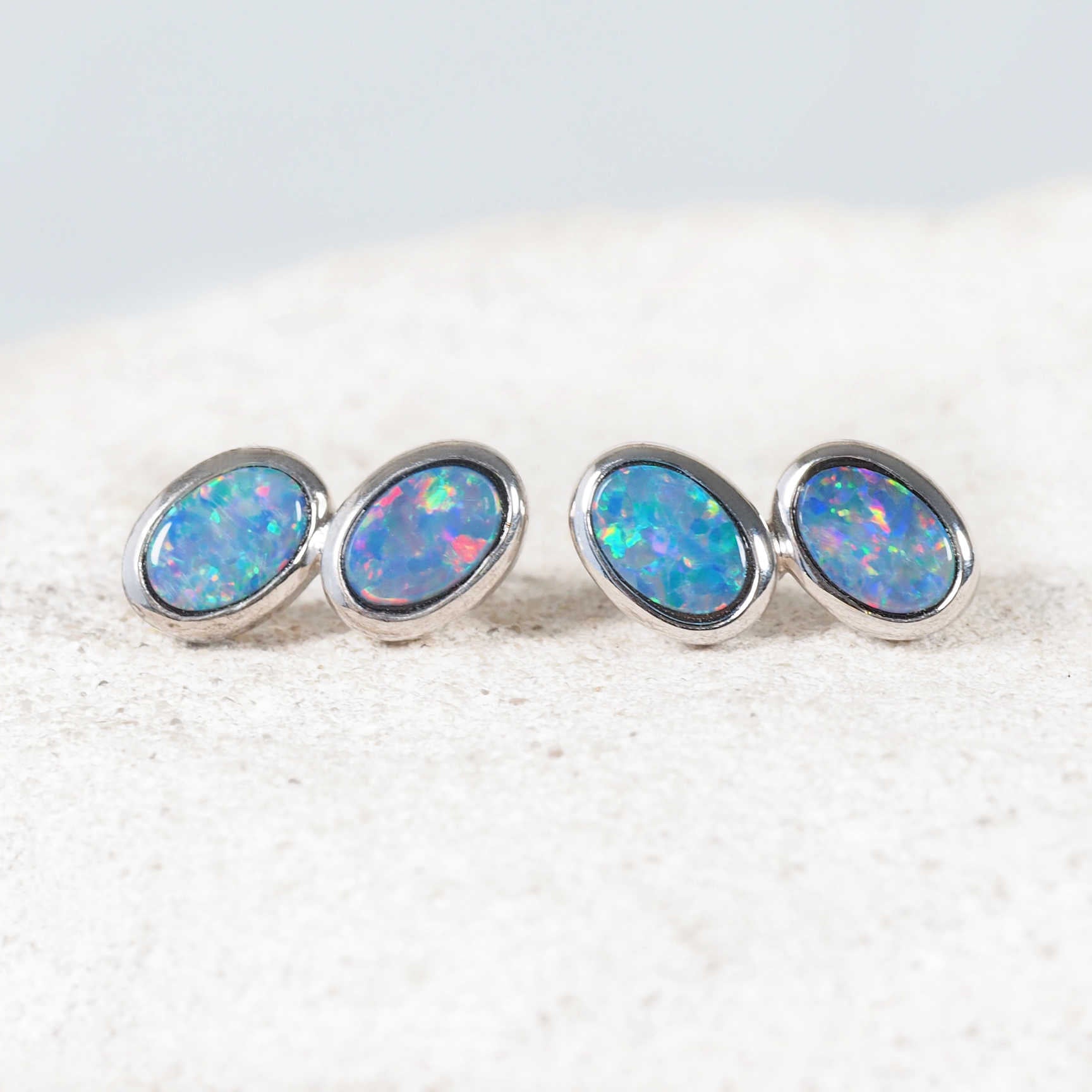 Australian opal earrings featuring bezel-set doublets in sleek silver design