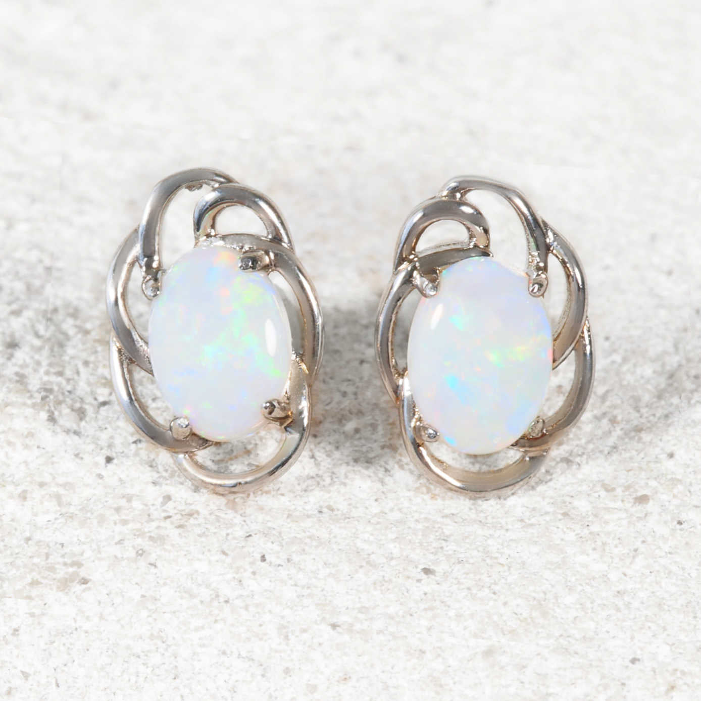 Sterling silver swirl design opal stud earrings with multi-coloured South Australian solid white opals