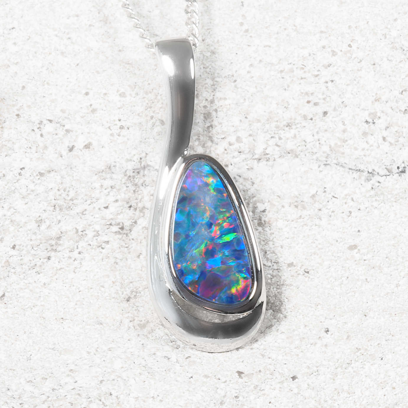 Genuine Australian opal doublet pendant in sterling silver with vibrant blue, green and red play-of-colour