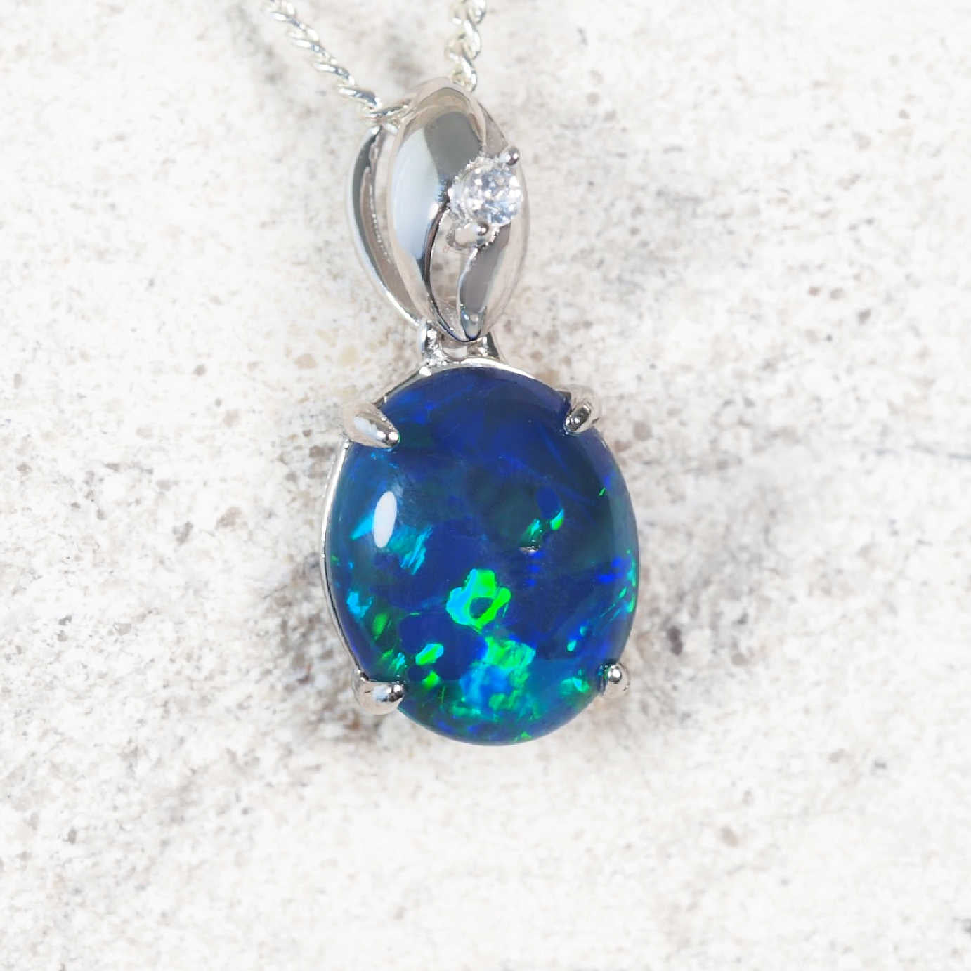 ‘Serena Blue’ sterling silver drop opal pendant with oval Australian triplet opal in deep blue and green tones