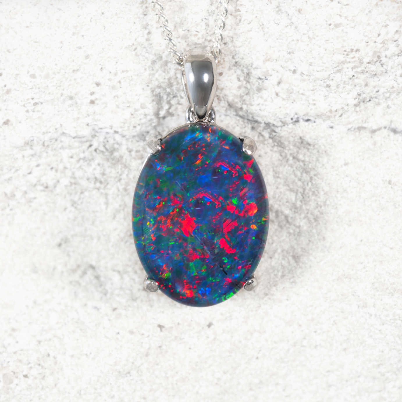 ‘Classic Queen Deux’ sterling silver opal pendant with claw-set oval Australian triplet opal in radiant multi-coloured tones