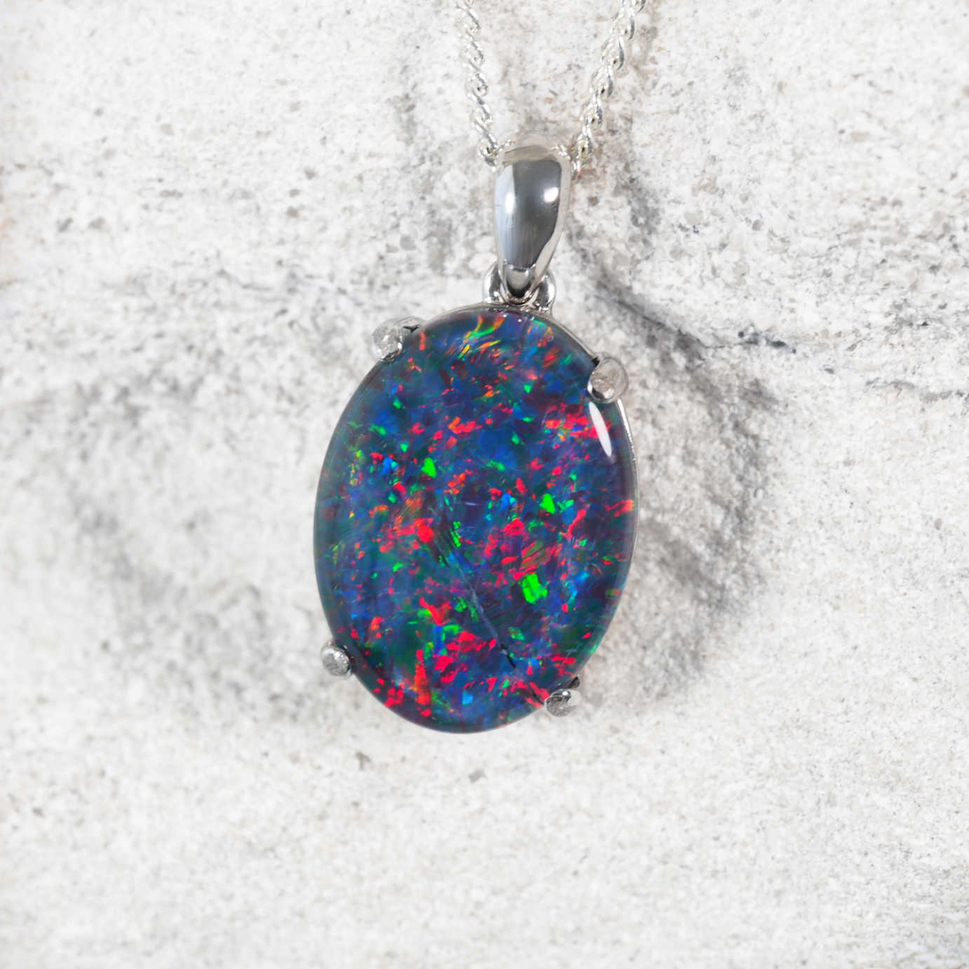 Elegant sterling silver statement opal necklace pendant featuring multi-coloured oval Australian triplet opal