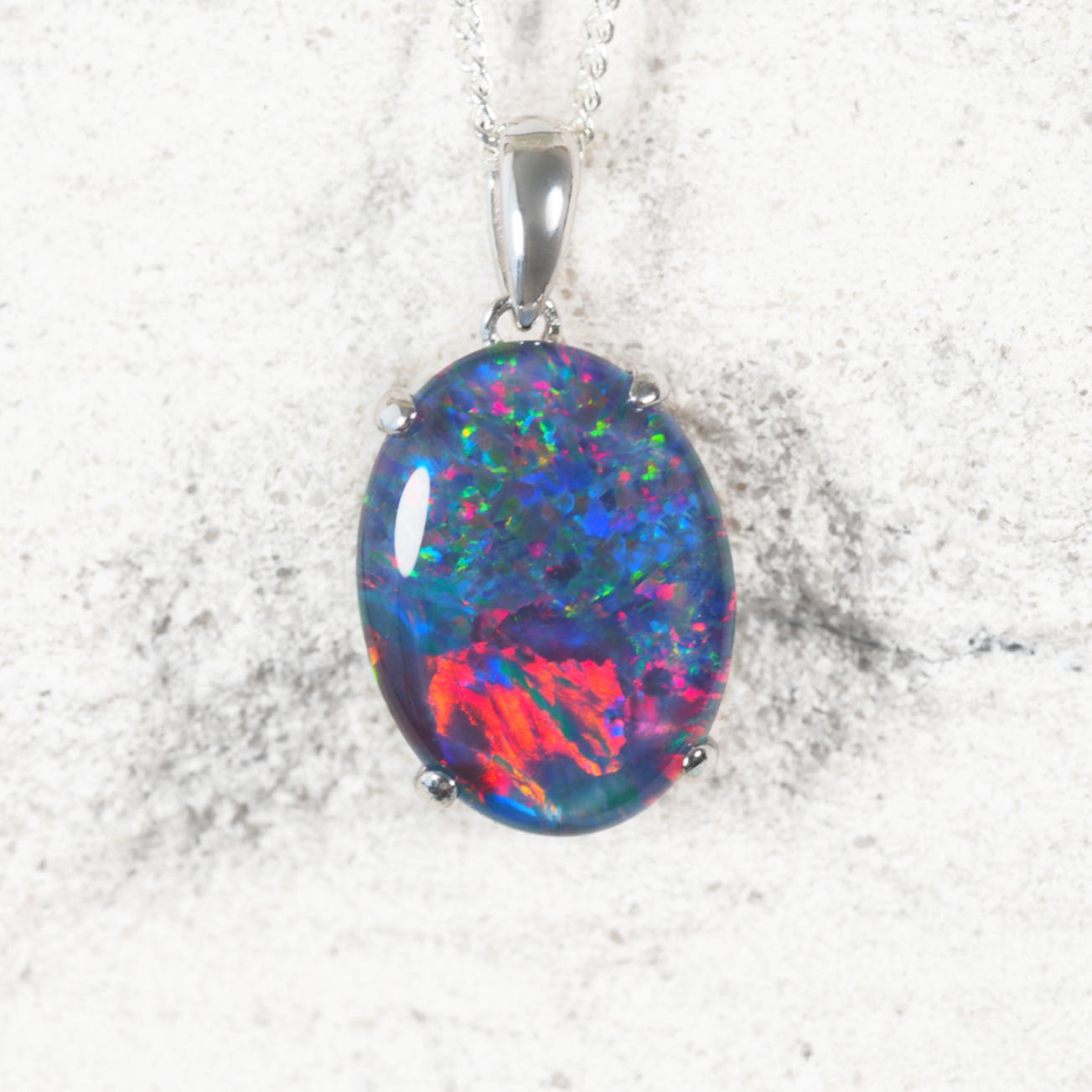 ‘Classic Queen’ sterling silver opal pendant with claw-set oval Australian triplet opal in vivid multi-coloured tones