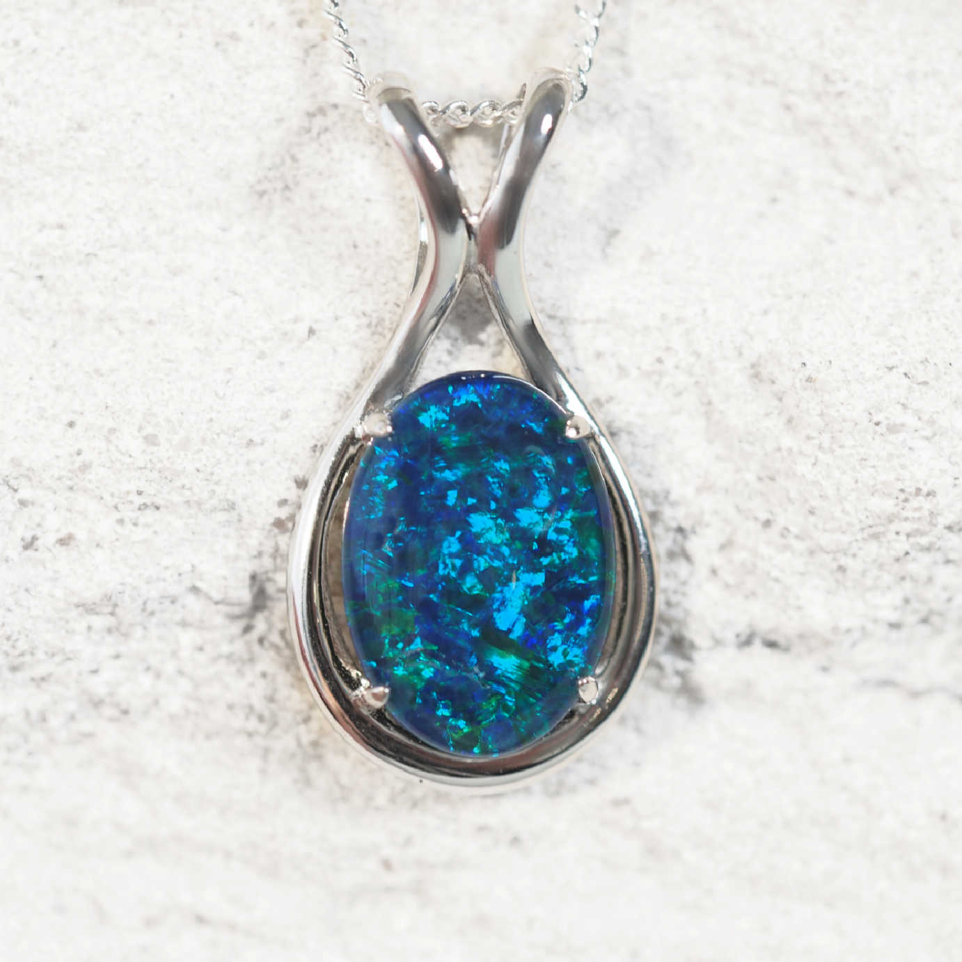 ‘Lucinda Blue’ sterling silver statement opal pendant with oval Australian triplet opal in vibrant blue and green tones