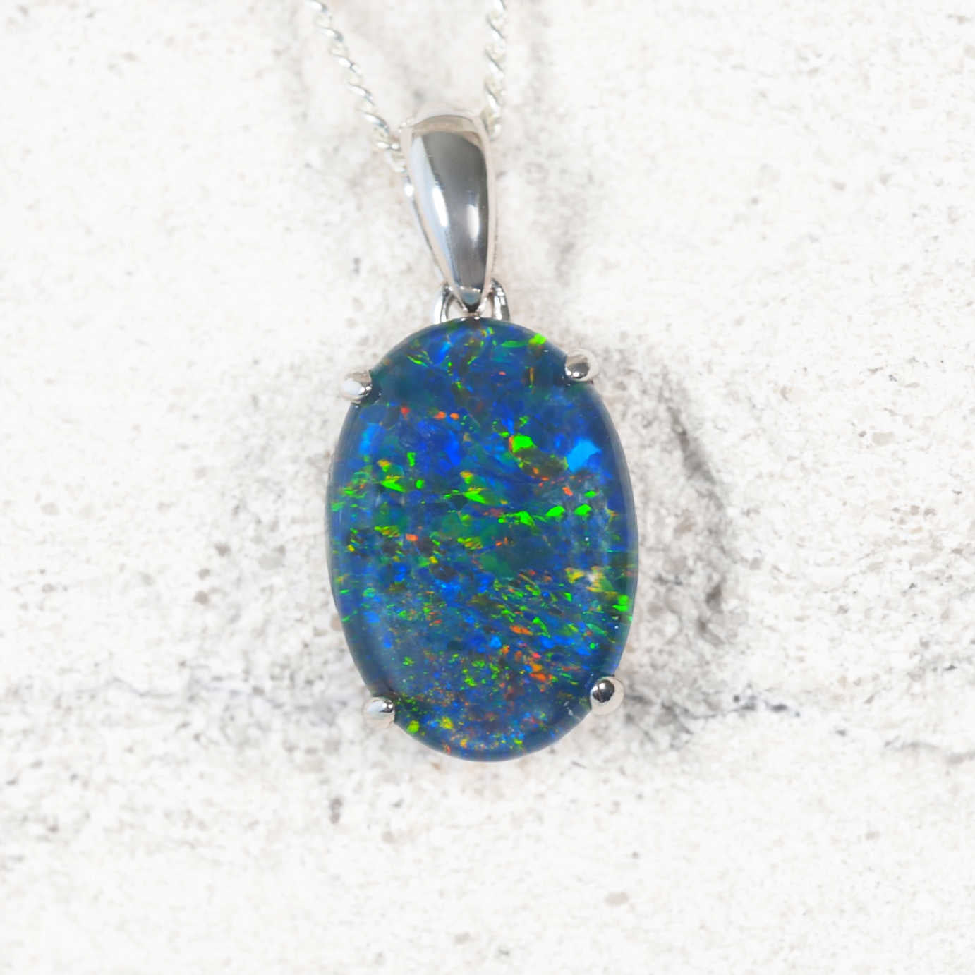 'Classic Grande' sterling silver opal pendant with claw-set oval Australian triplet opal in vivid multi-colour flashes, statement necklace design