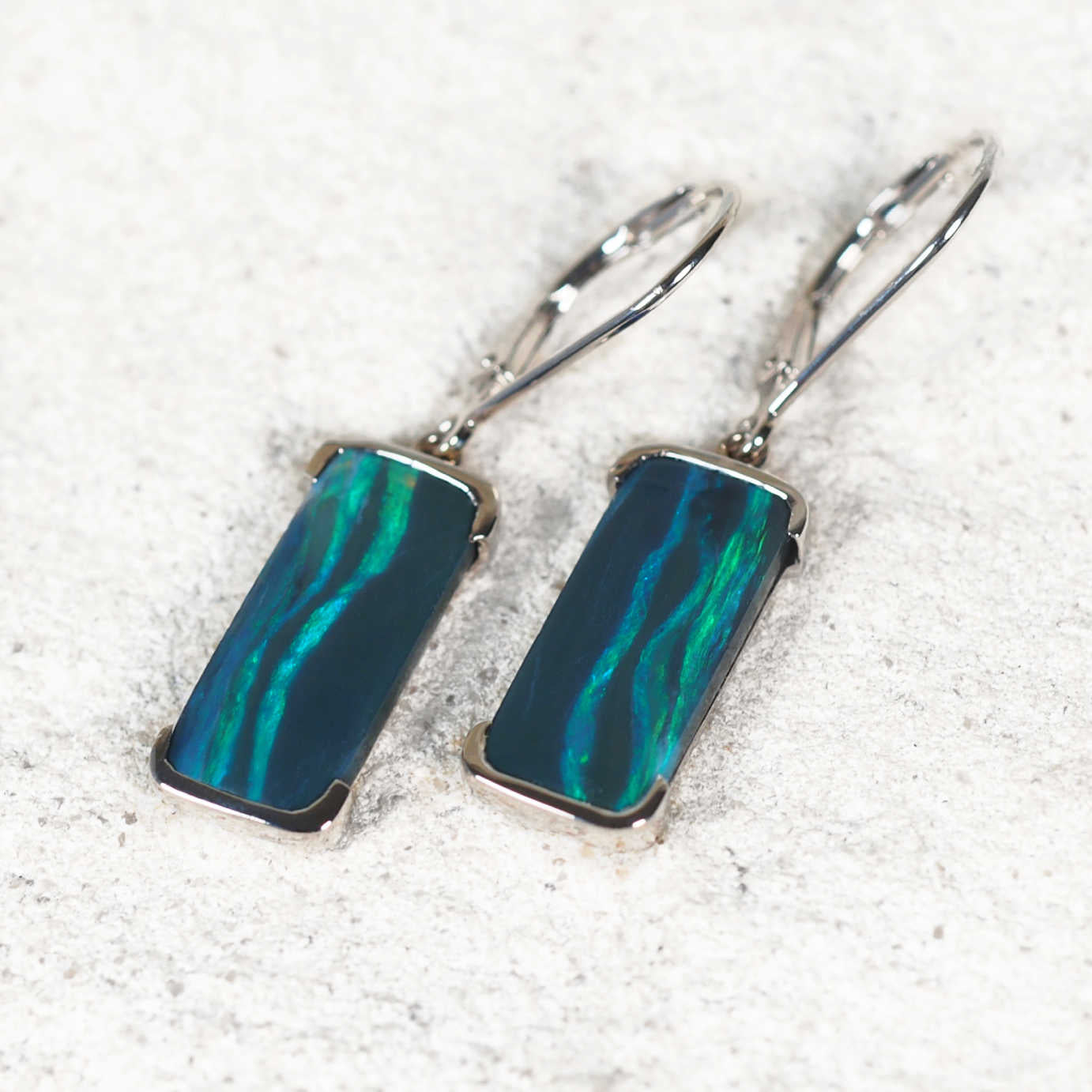 Elegant 14ct white gold rectangular black opal earrings with green play-of-colour – 'Corinna' design by Black Star Opal
