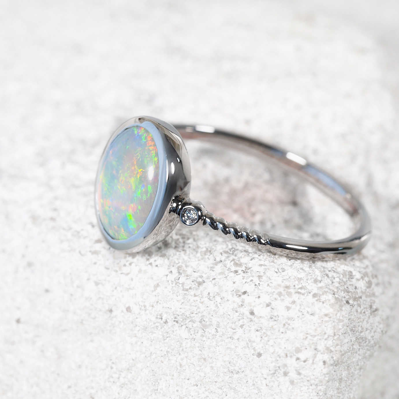 Colourful Australian opal set in white gold ring with diamonds