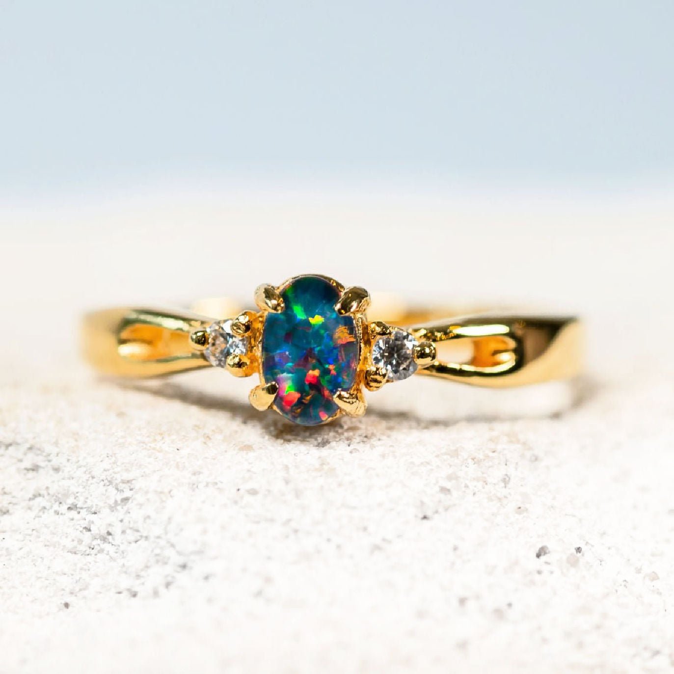 genuine opal ring set with diamantes in gold plated silver band