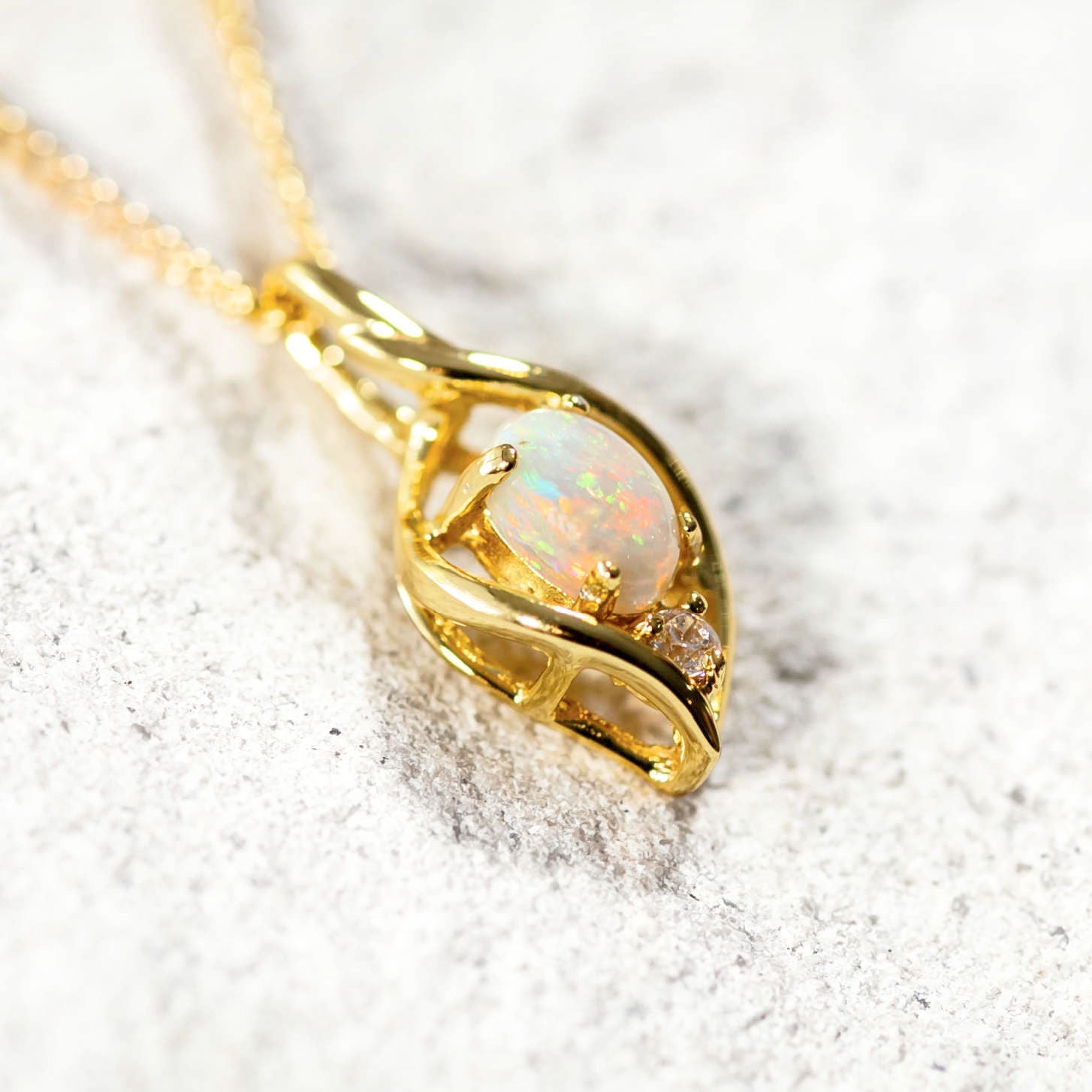 decorative opal necklace with a sparkling crystal