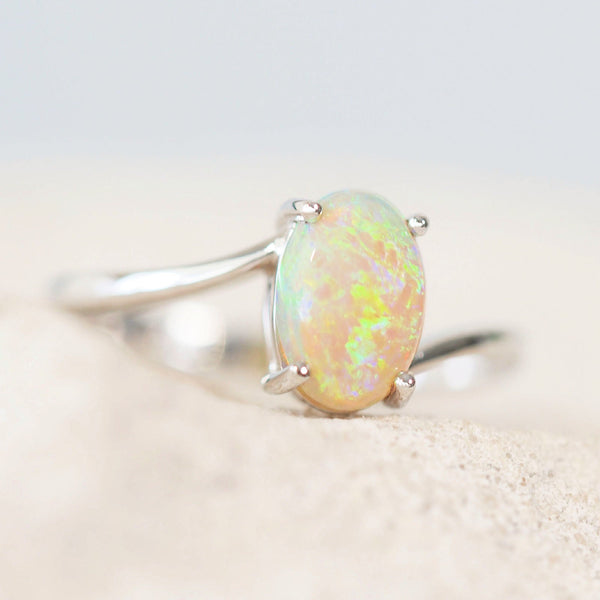crystal opal ring set in white gold