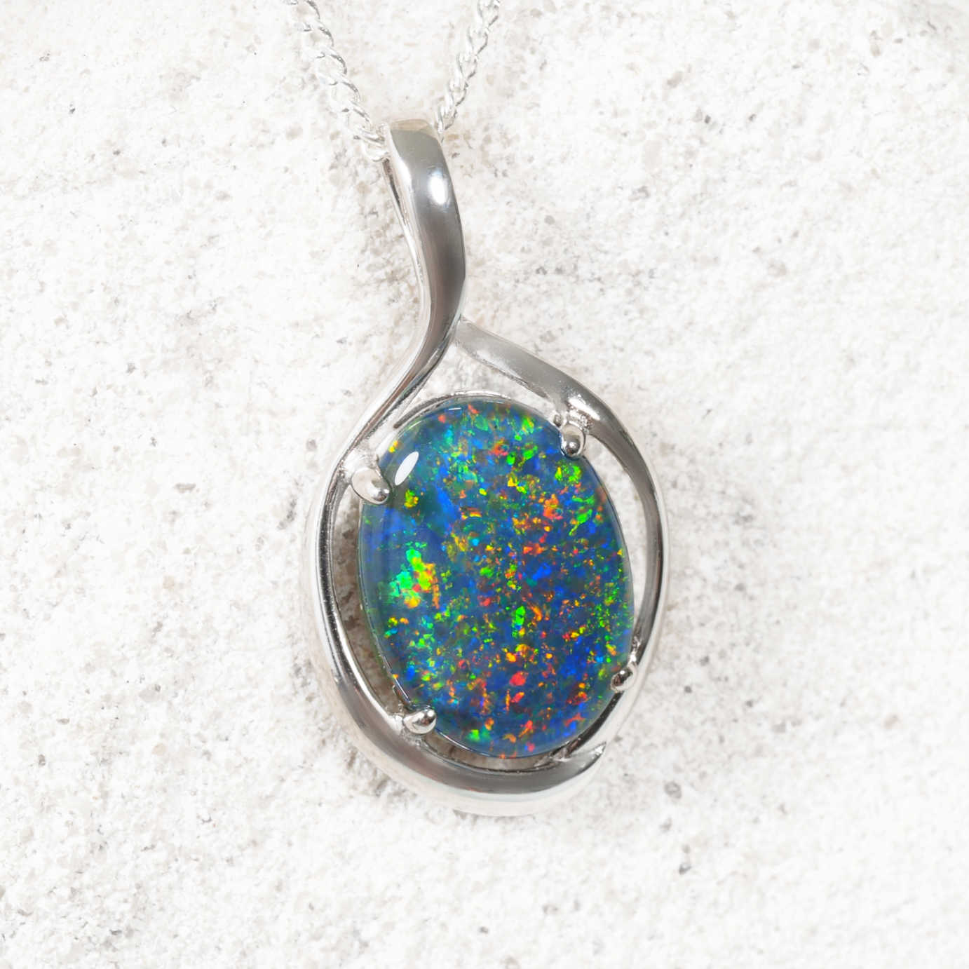Statement silver opal pendant featuring colourful triplet opal