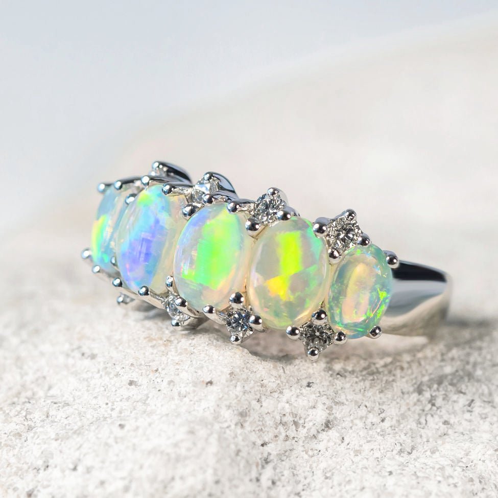 five bright crystal opals set in white gold