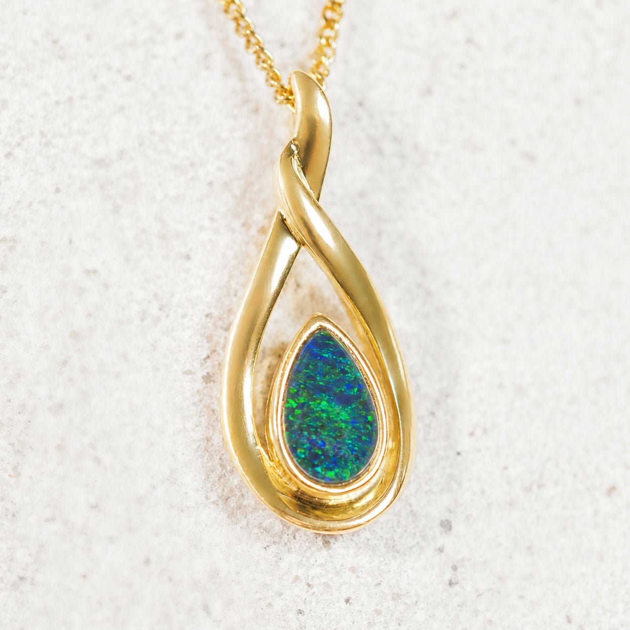 blue and green opal pendant set in gold plated silver