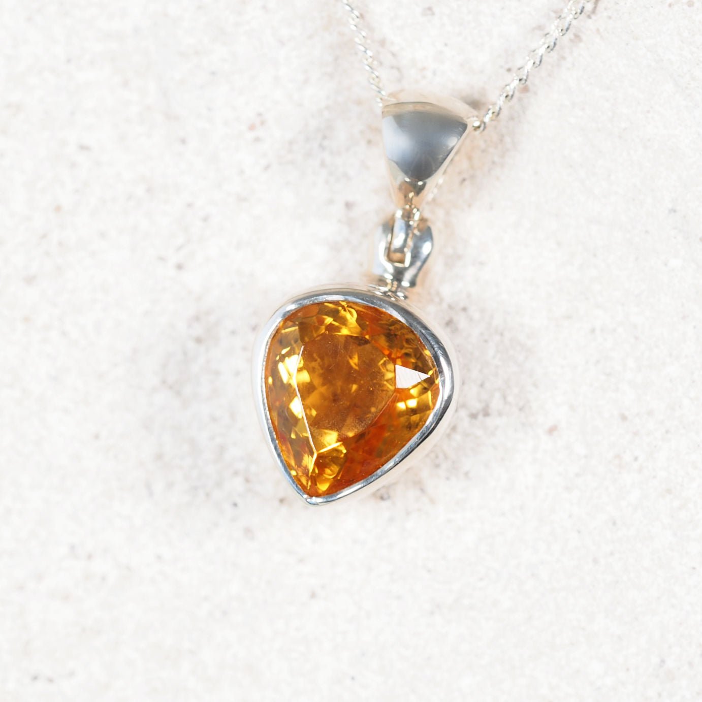 The 'Amy' square Citrine pendant in silver, featuring warm golden-yellow gemstone with faceted sparkle