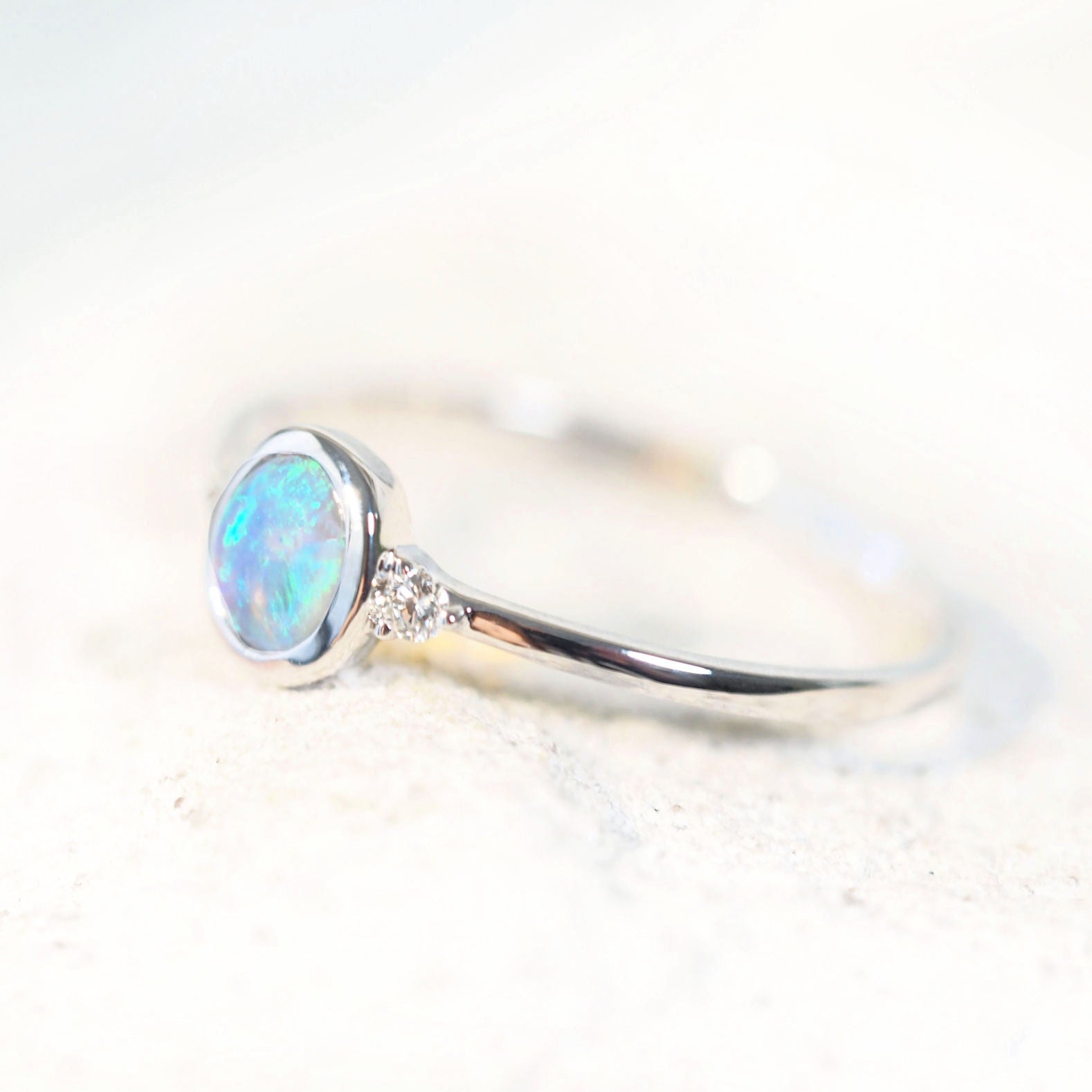 blue and green crystal opal from Lightning ridge set into a white gold ring