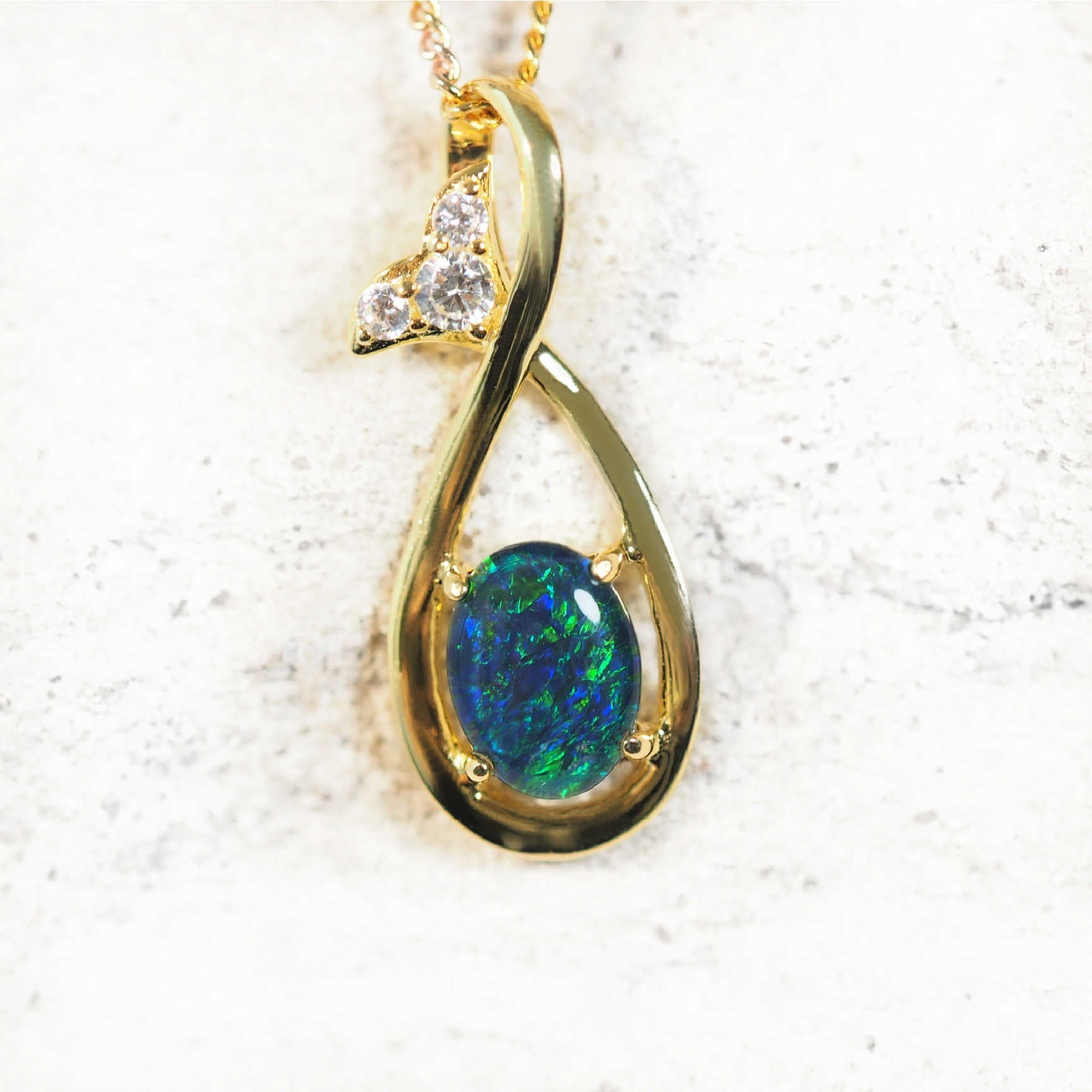 Gold-plated opal pendant with blue and green Australian triplet opal and cubic zirconias on matching chain