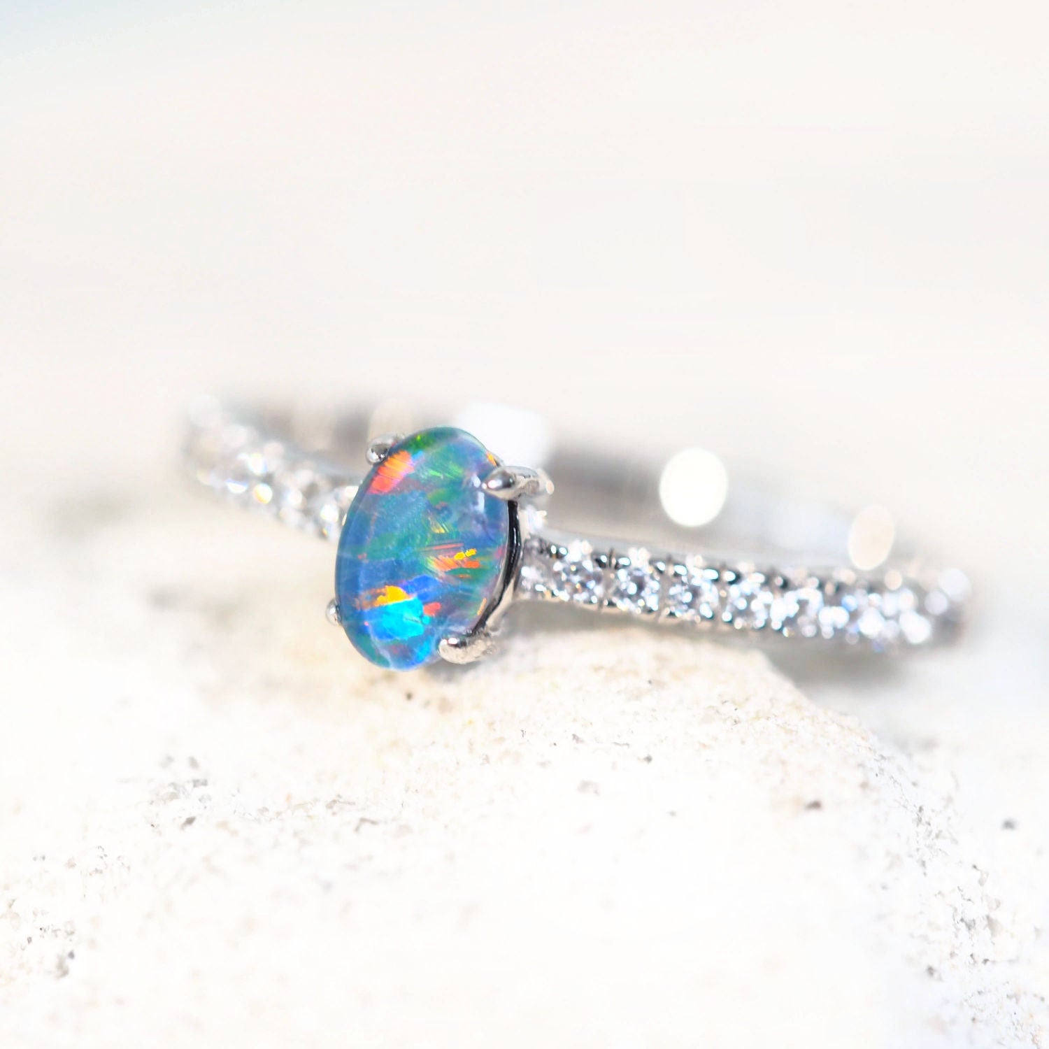 colourful opal ring with 16 sparkling cubic zirconias