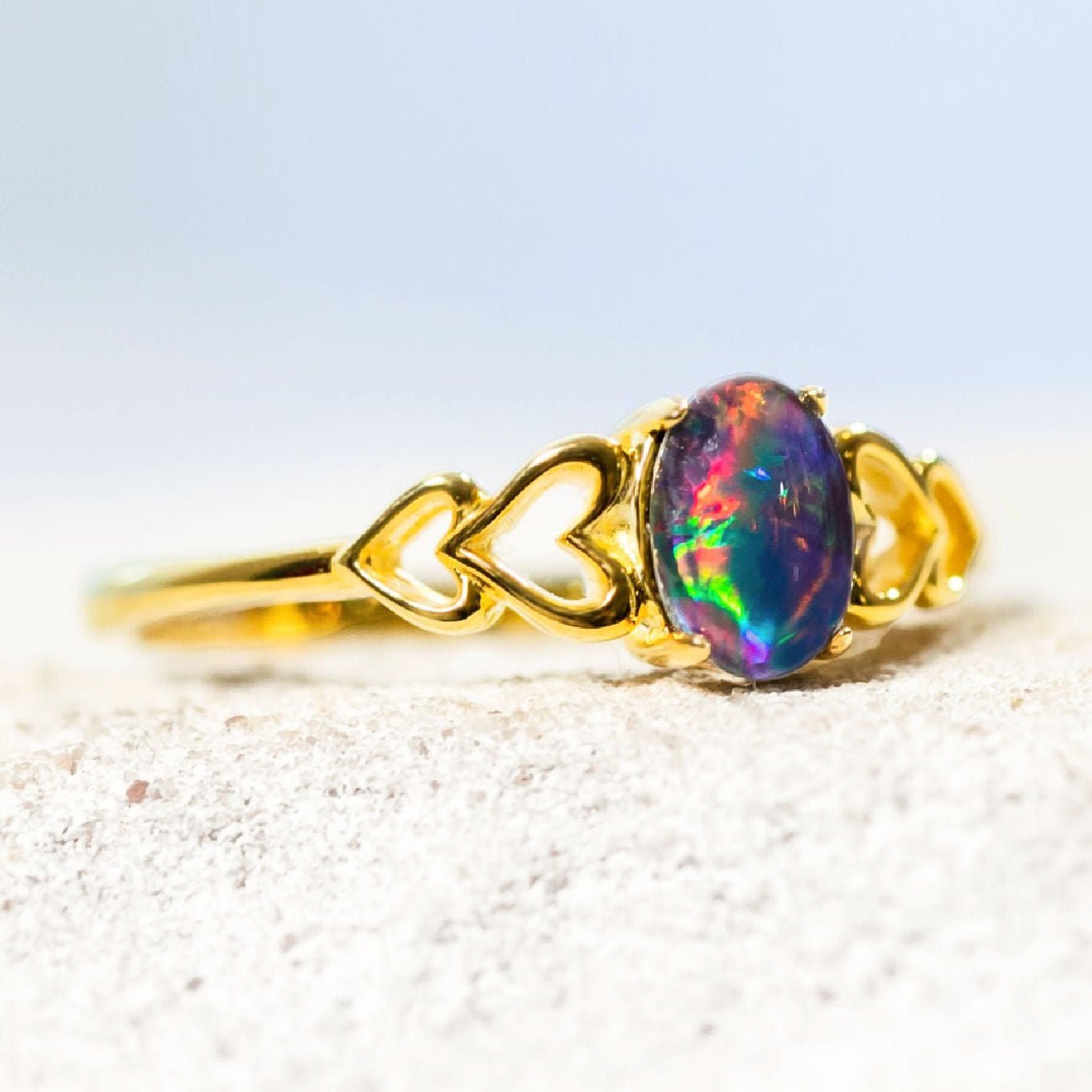 colourful opal ring with a heart shape design