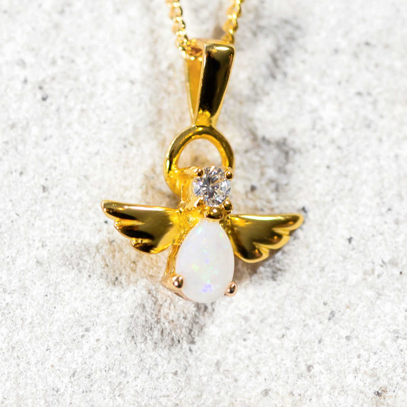 angel design white opal pendant in gold plated silver