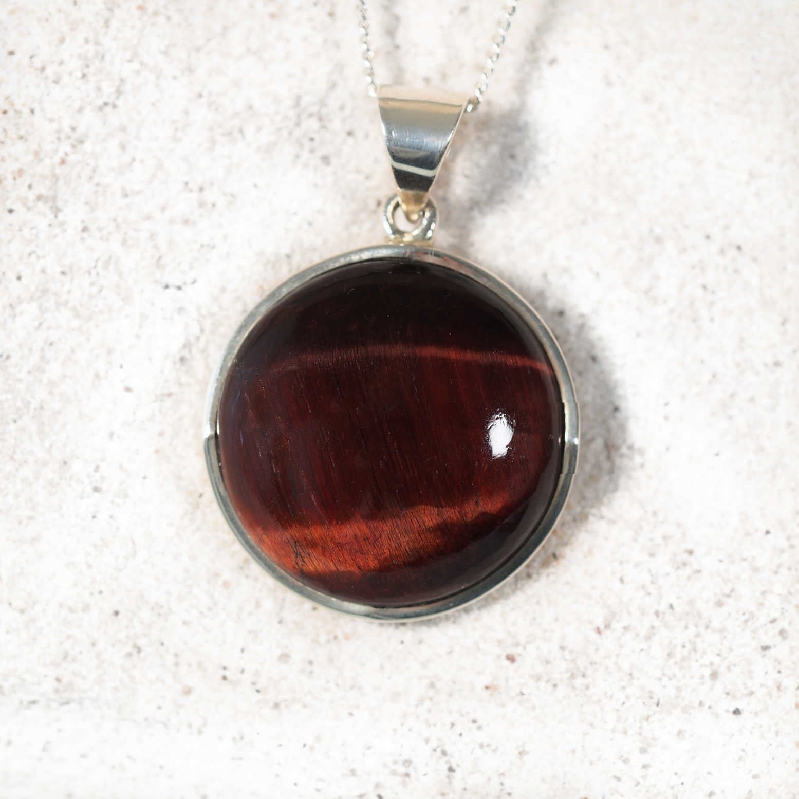 Red Tiger Eye Pendant glowing with natural red hues