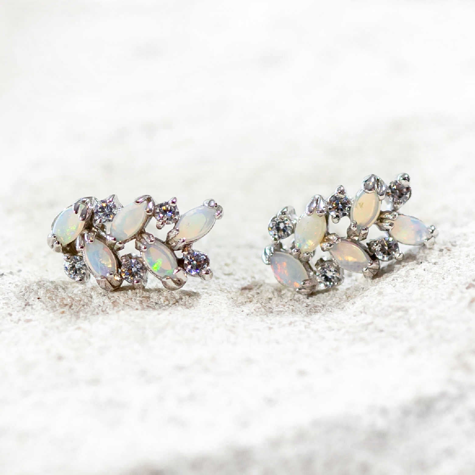 silver opal earrings set with 10 marquise shaped gemstones