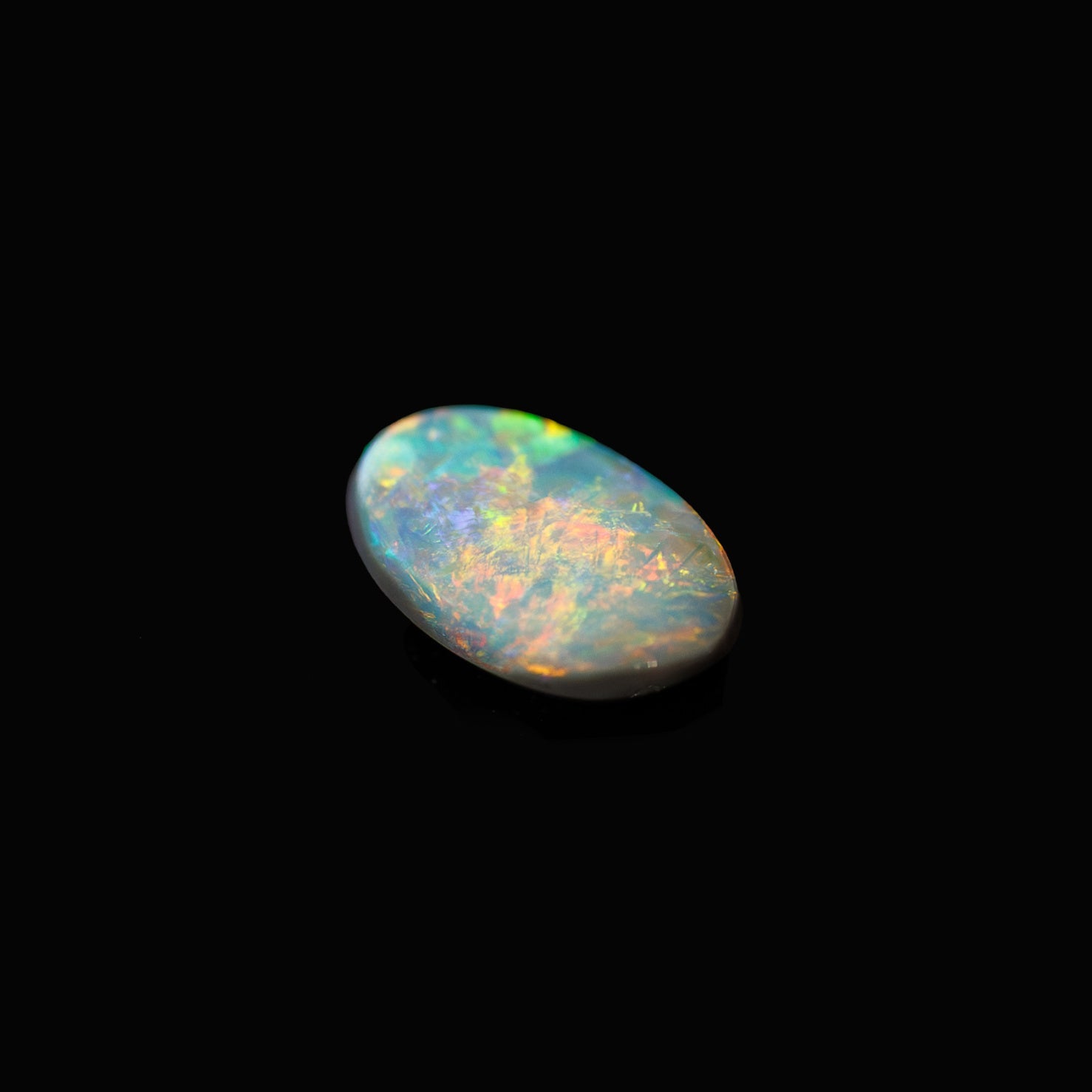 One-of-a-kind Lightning Ridge opal with fiery multicolour patterns in a classic oval cut