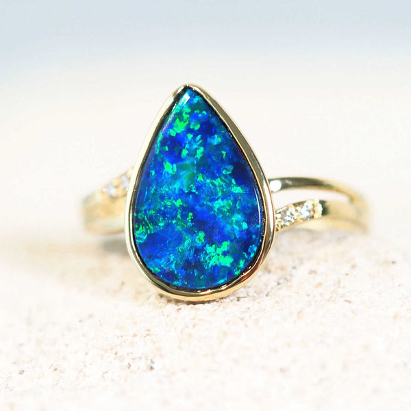 gold opal ring set with a blue and green doublet opal