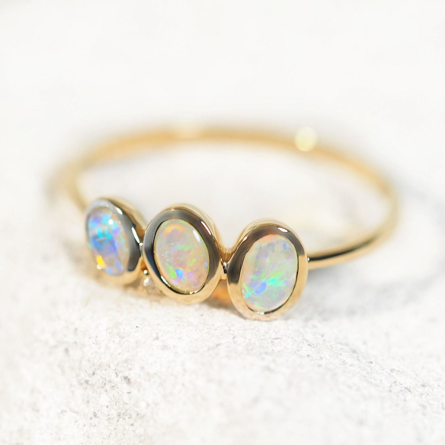 Handcrafted 14ct yellow gold band featuring solid Lightning Ridge opals