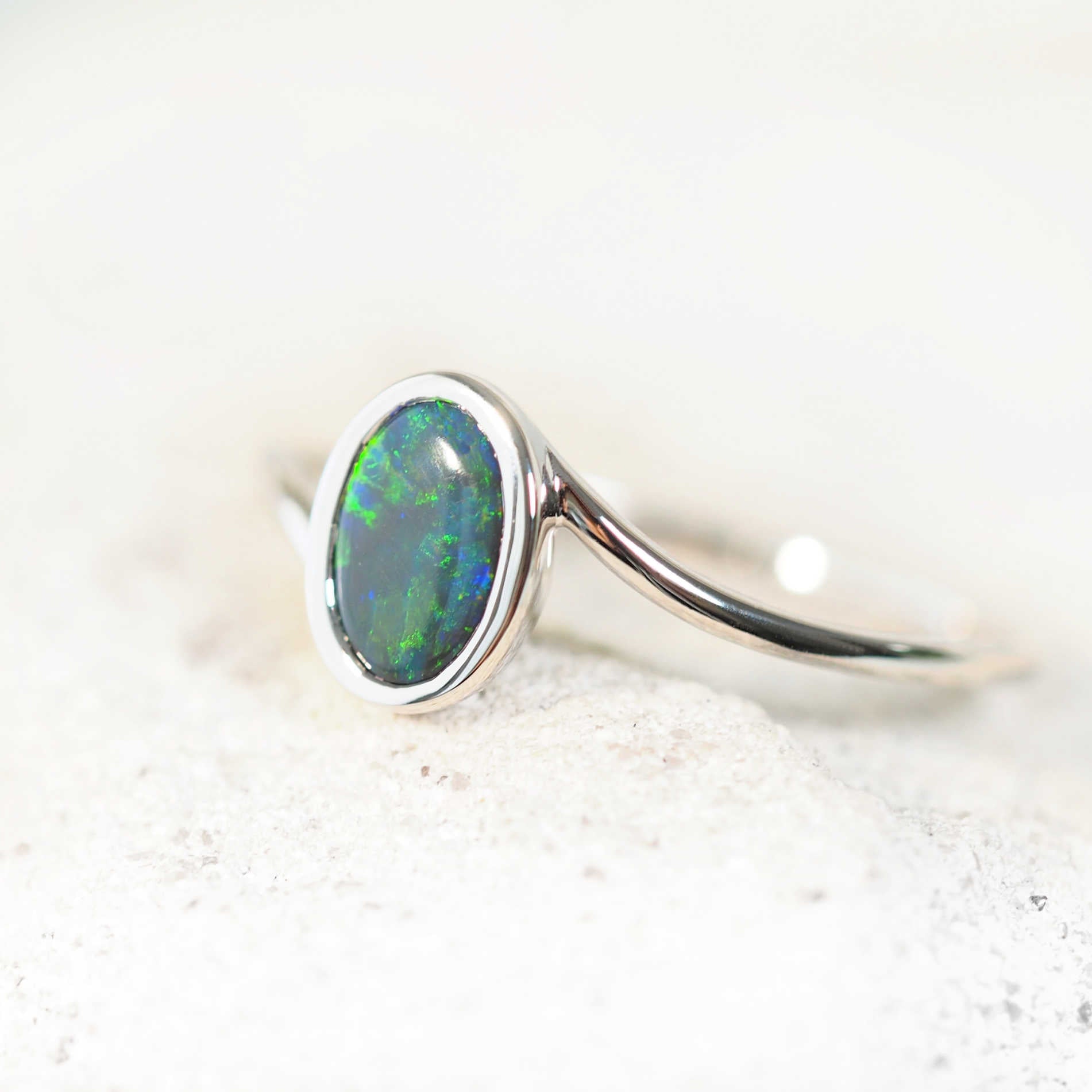 lightning ridge opal ring set in white gold