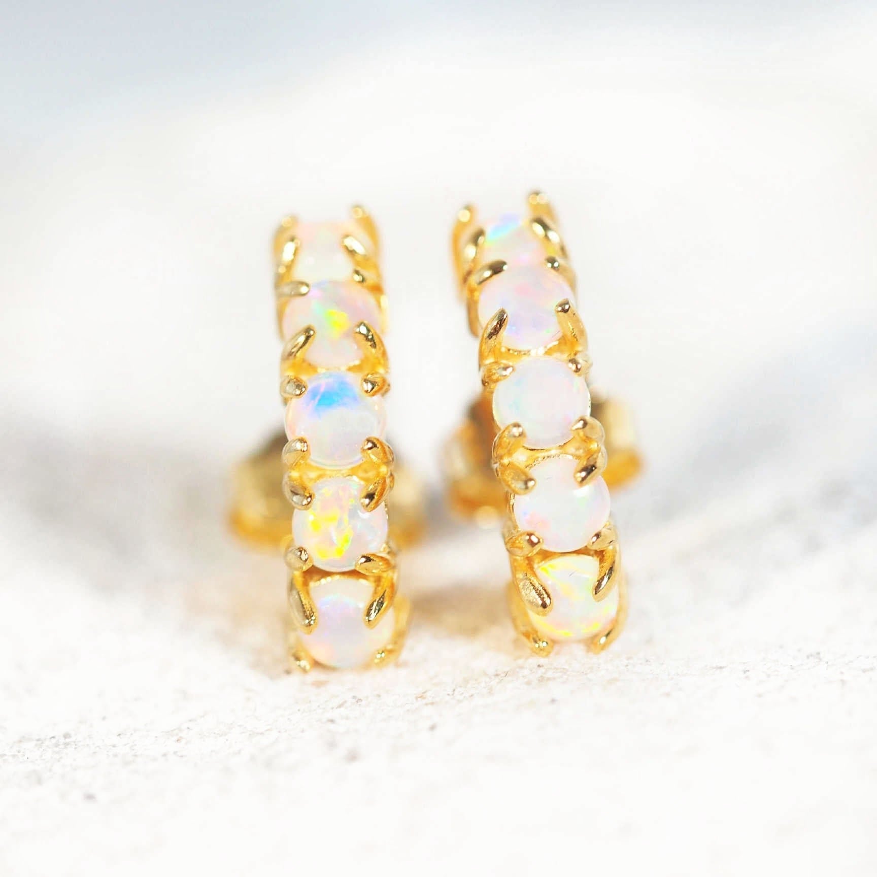 five opal earrings with gold plated silver