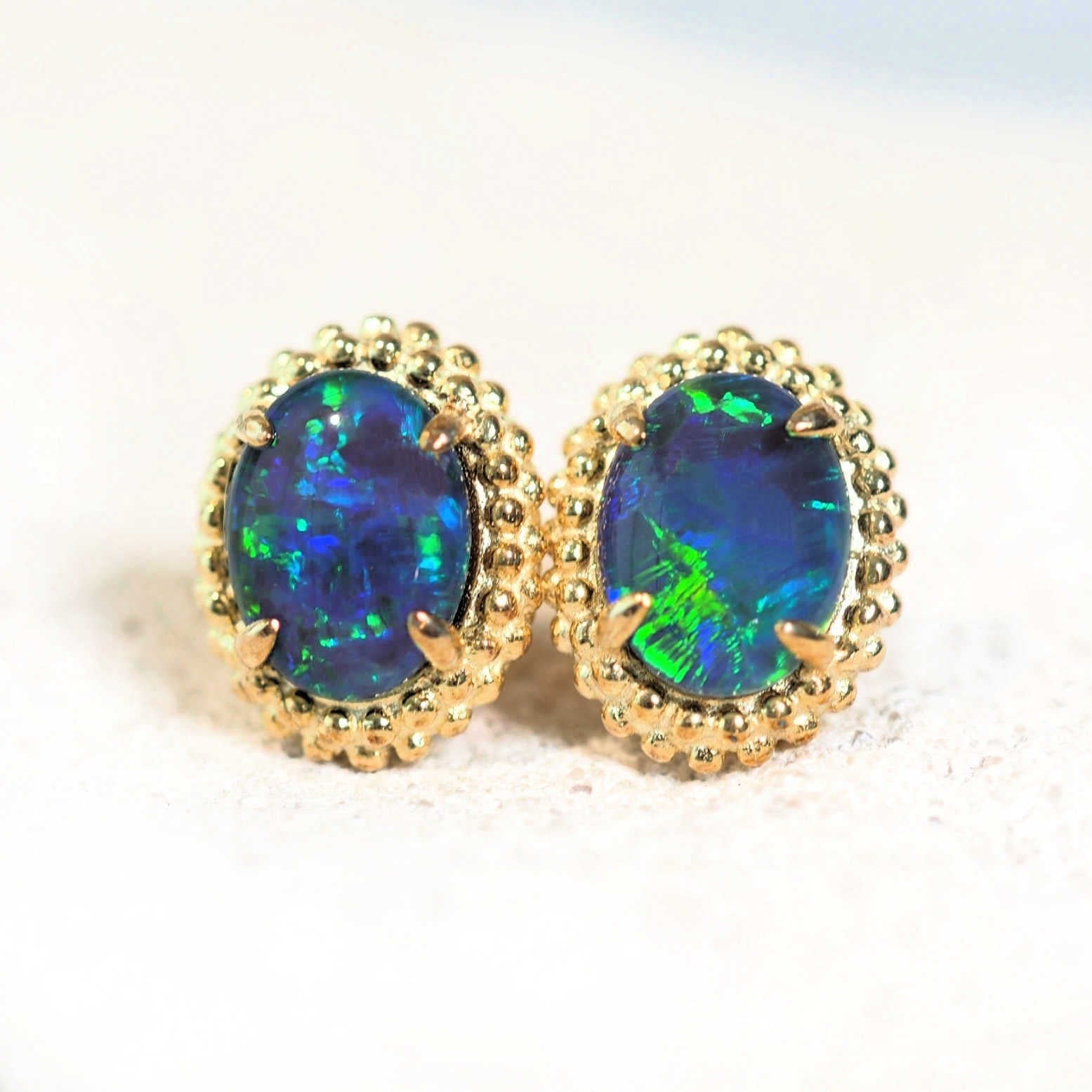 blue and green australian opal earrings in a blossom style