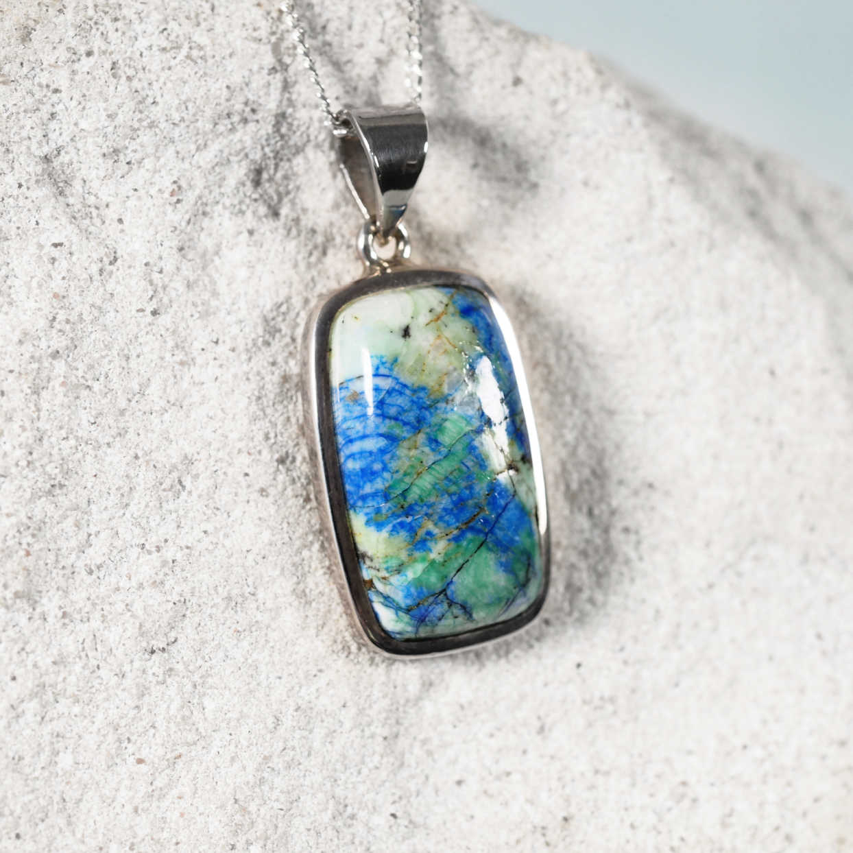 'Brea' pendant with square Azurite/Chrysocolla stone set in silver, showing rich blue and green tones