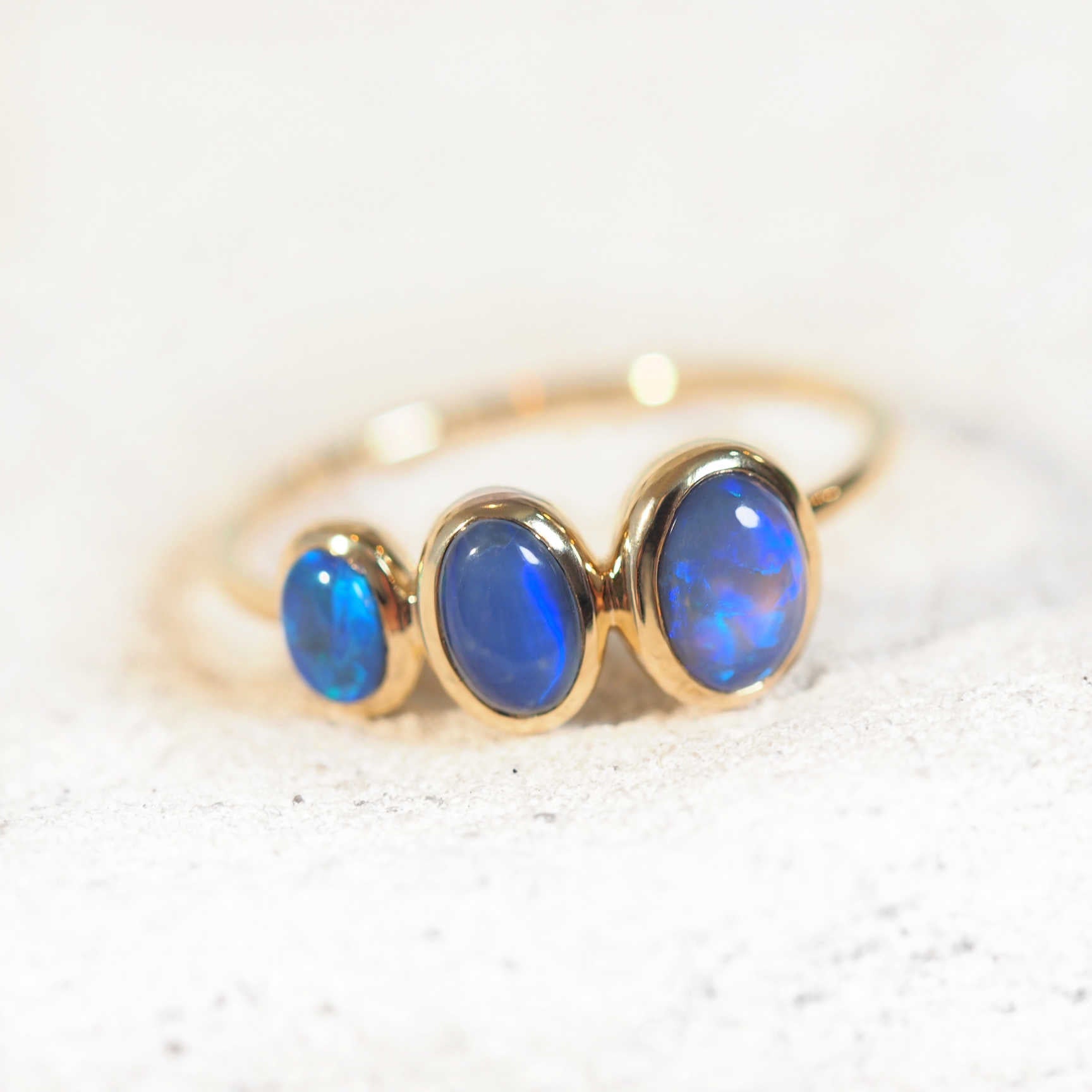 blue opal ring set with three black opals from Lightning Ridge