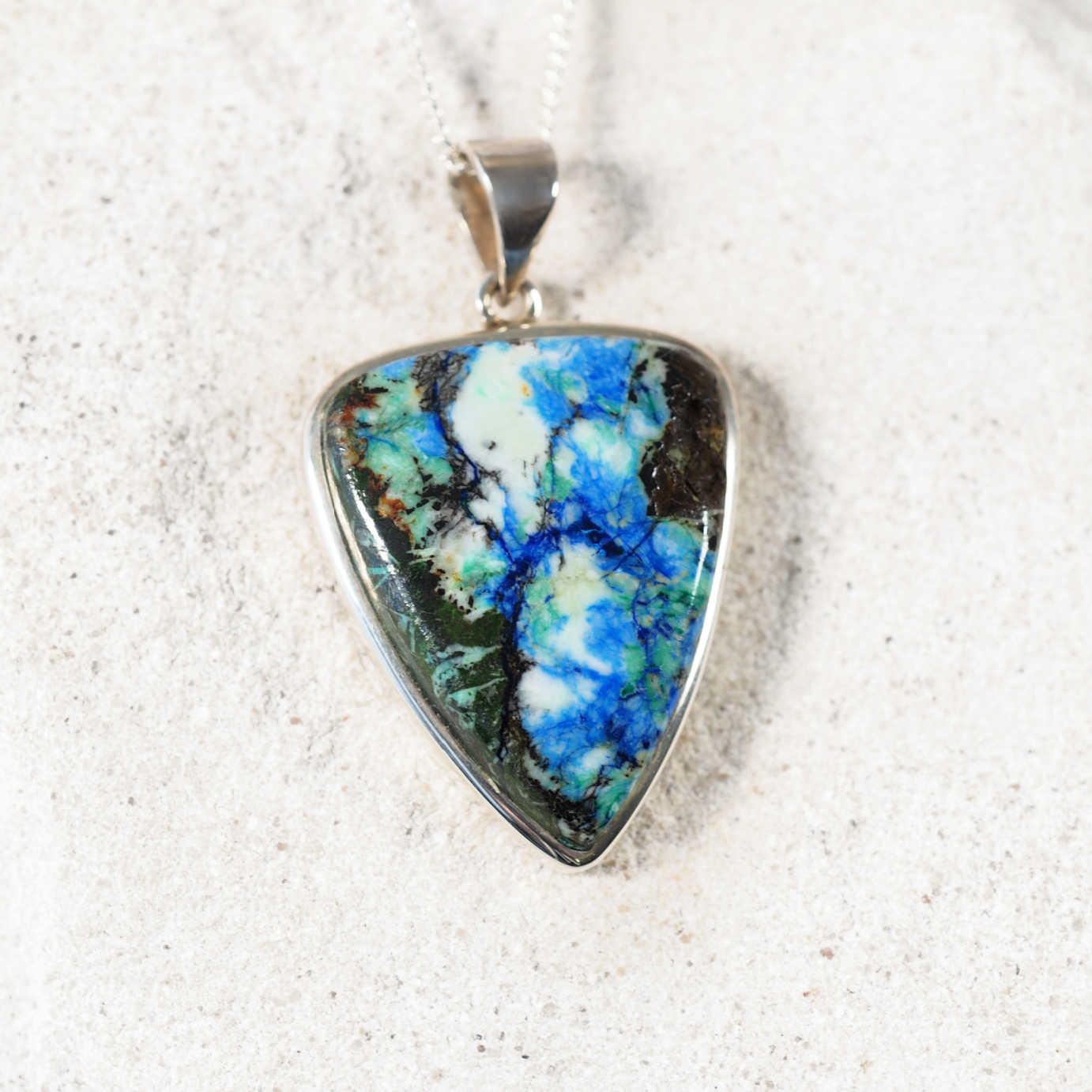 Close-up of 'Callie' Azurite/Chrysocolla pendant highlighting blue-green stone and silver frame