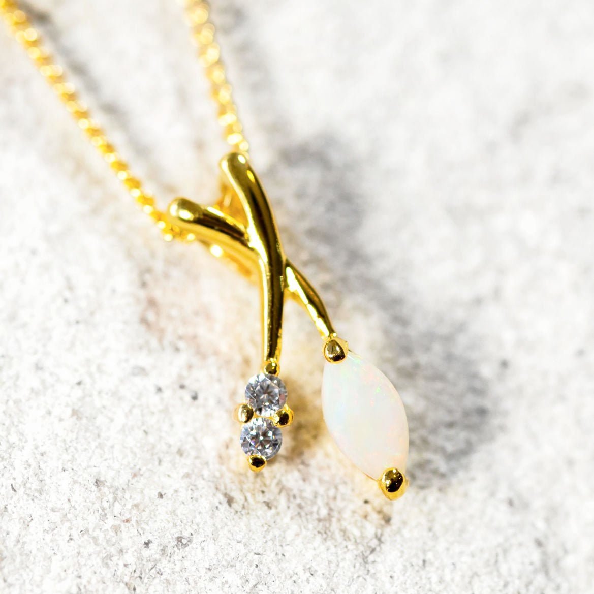 marquise shaped opal set into a decorative pendant