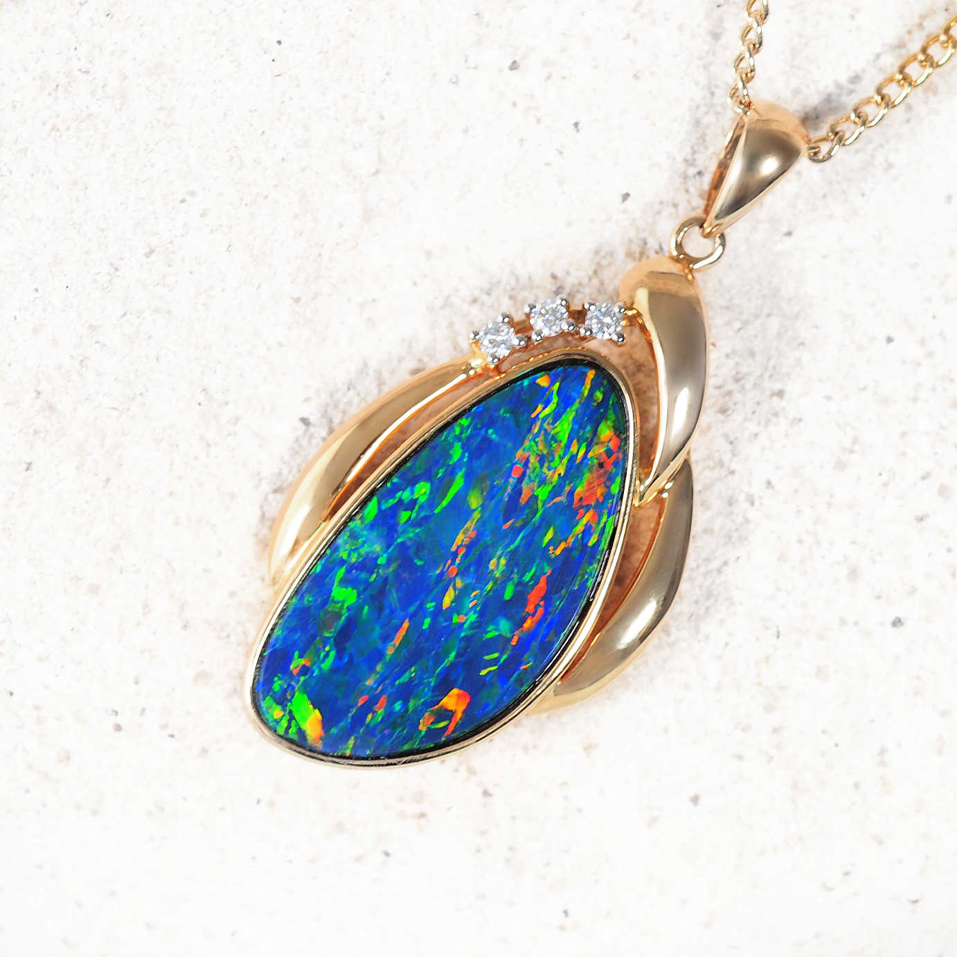 ‘Camille’ 14ct yellow gold opal pendant – teardrop Australian doublet opal with diamond accents by Black Star Opal