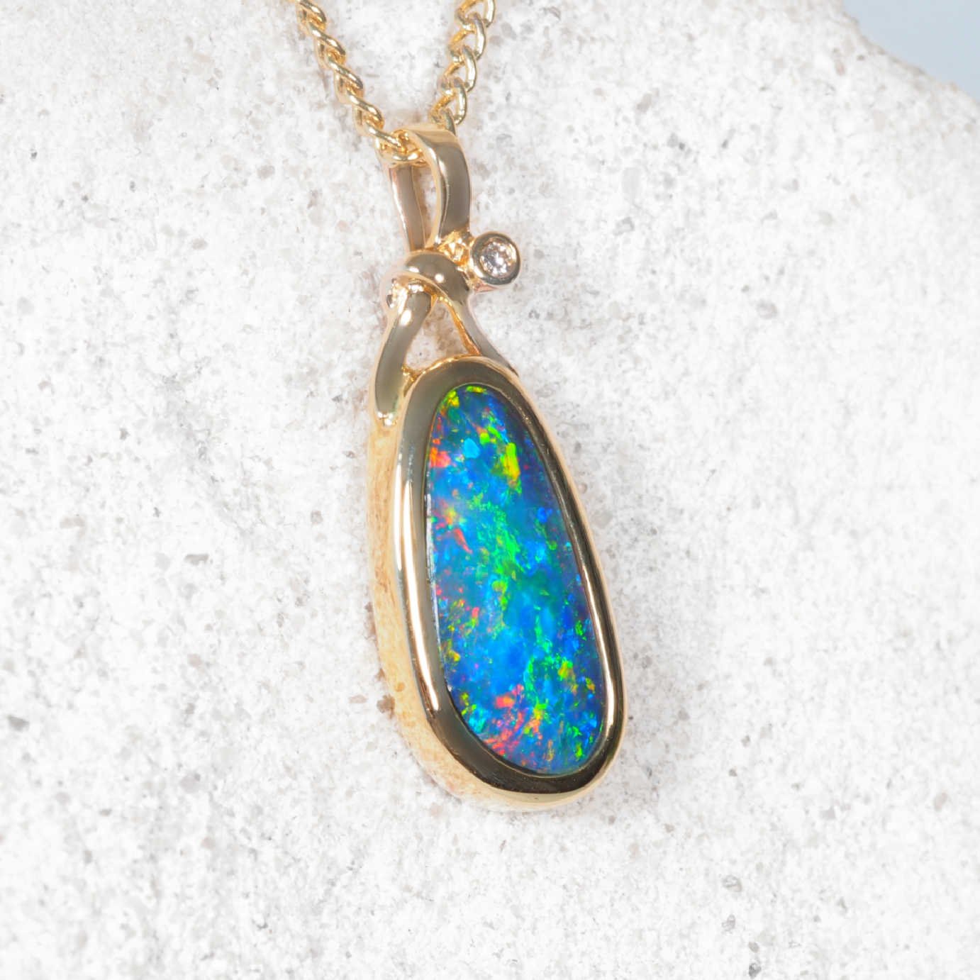 14ct yellow gold opal pendant with blue Australian doublet and diamond
