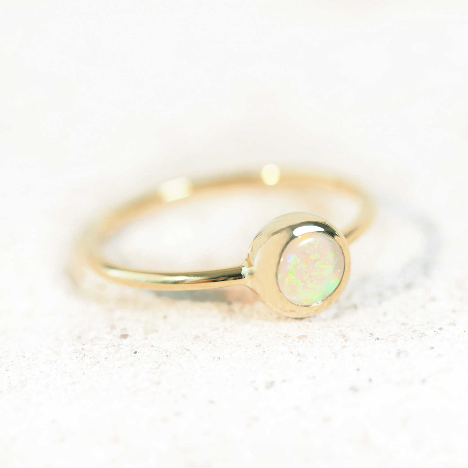 elegant opal ring set in 14ct yellow gold