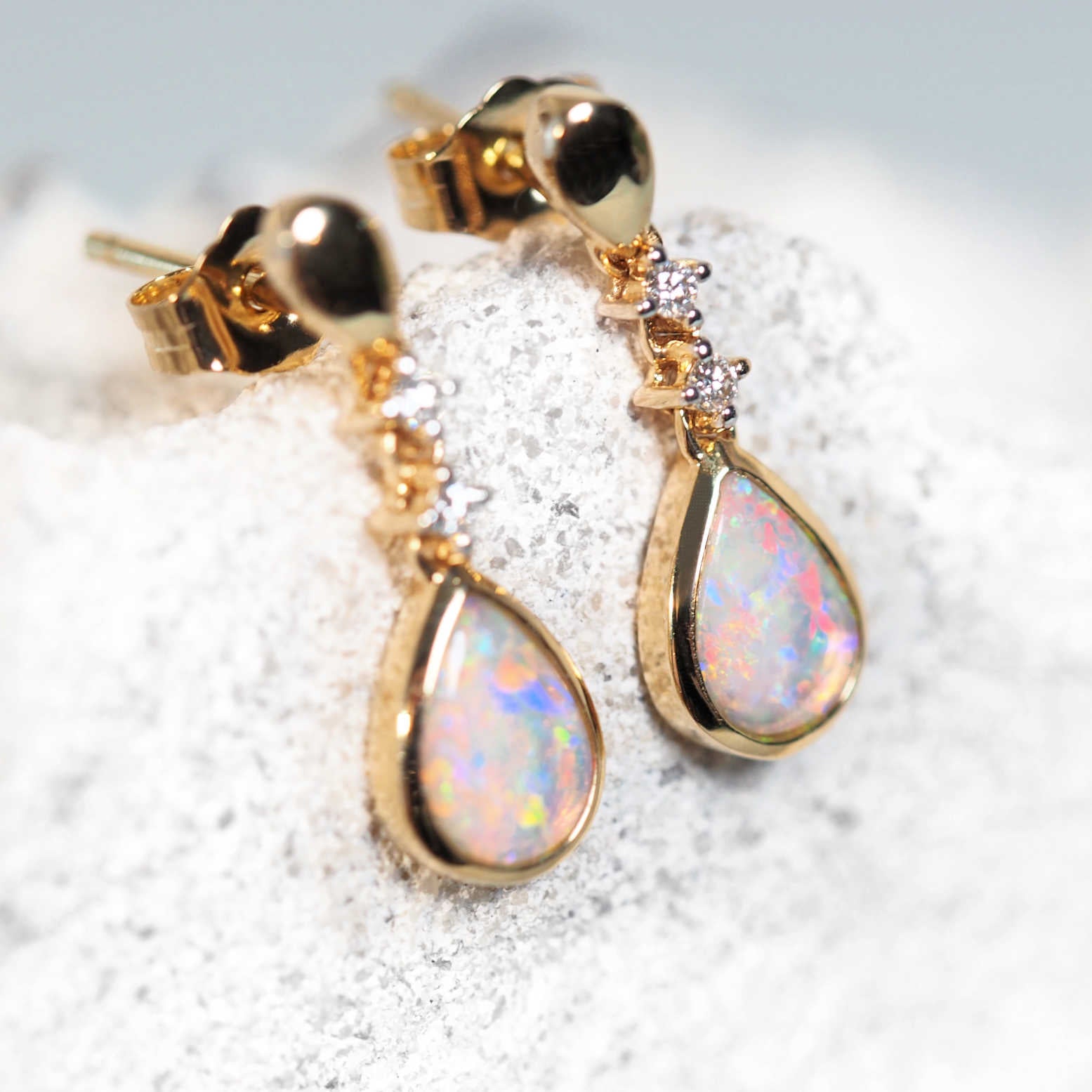 Colourful opal drop earrings set in 14ct yellow gold with diamonds