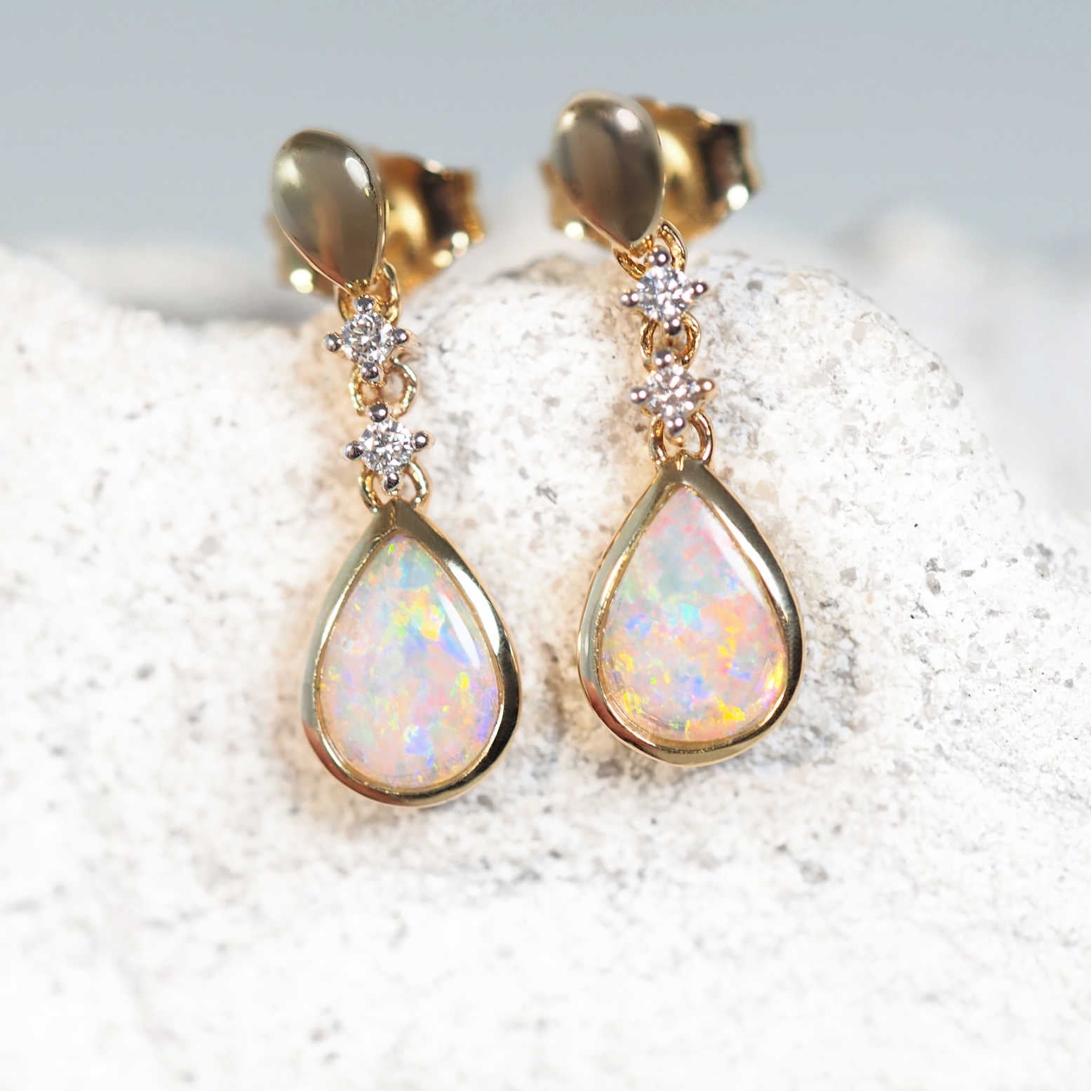 drop opal earrings set in 14ct yellow gold