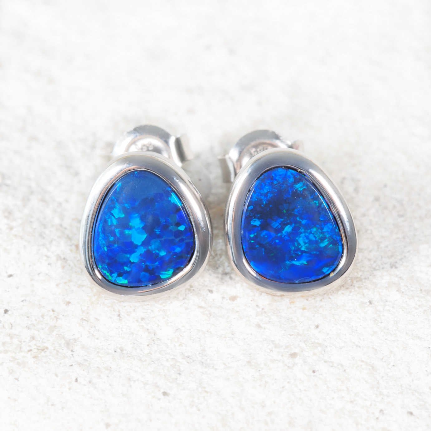 blue opal earrings in white gold