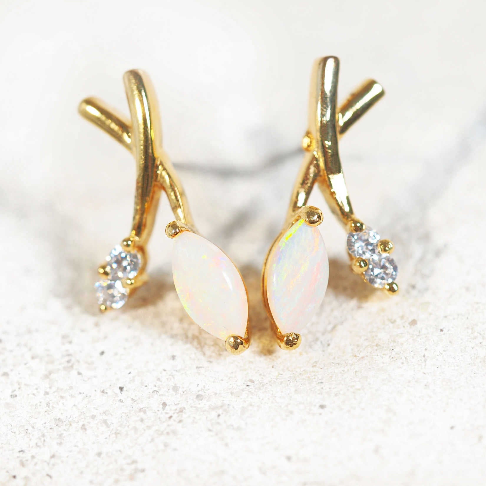 marquise opal earrings set in gold plated silver
