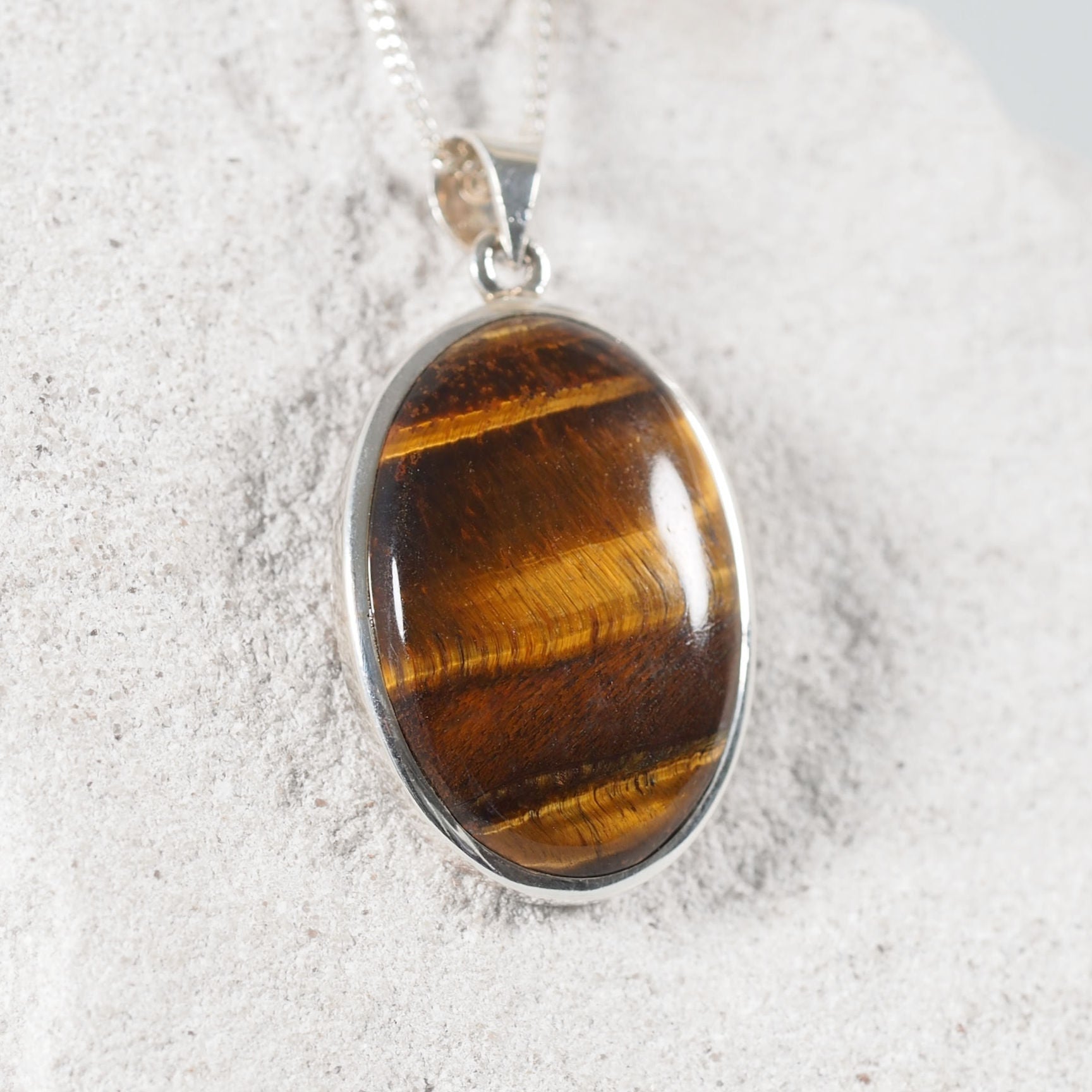 'Chiara' pendant featuring a tiger eye gemstone with brown hues 