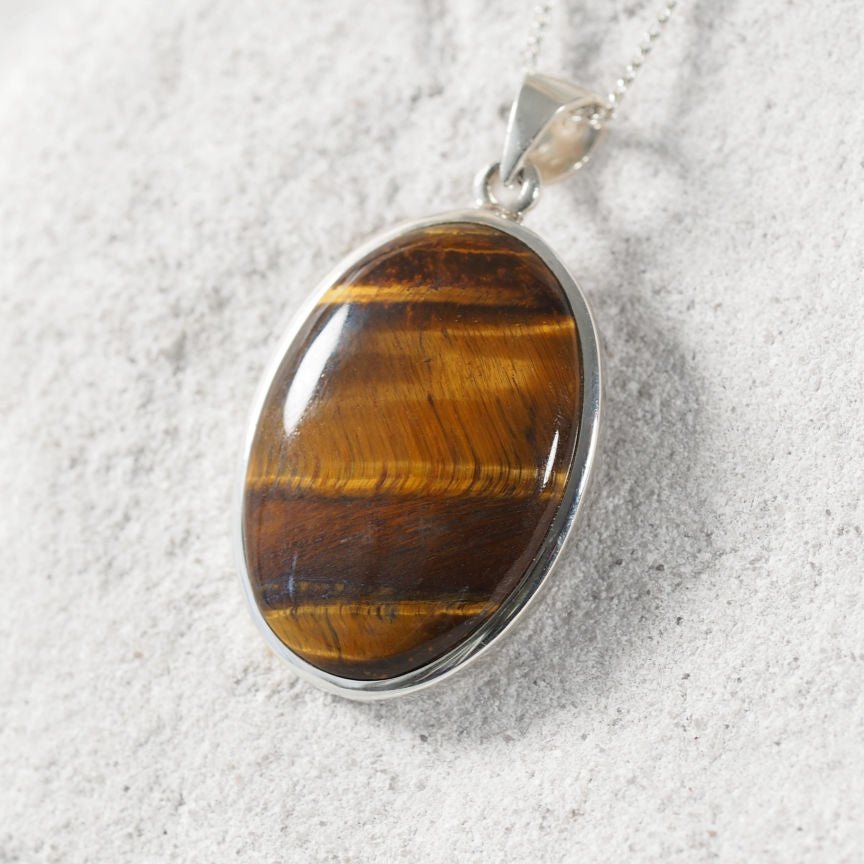 Sterling silver 'Chiara' pendant featuring golden-brown Tiger’s Eye gemstone.