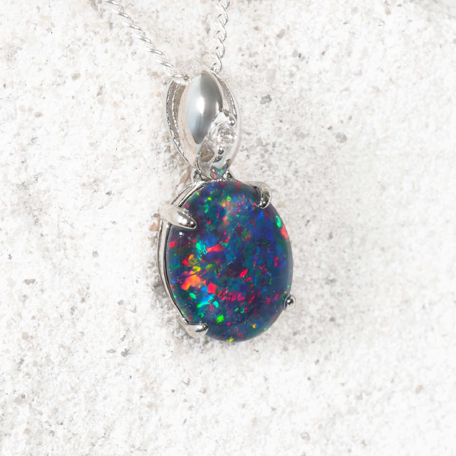 Elegant silver opal necklace featuring oval Australian triplet opal with play-of-colour
