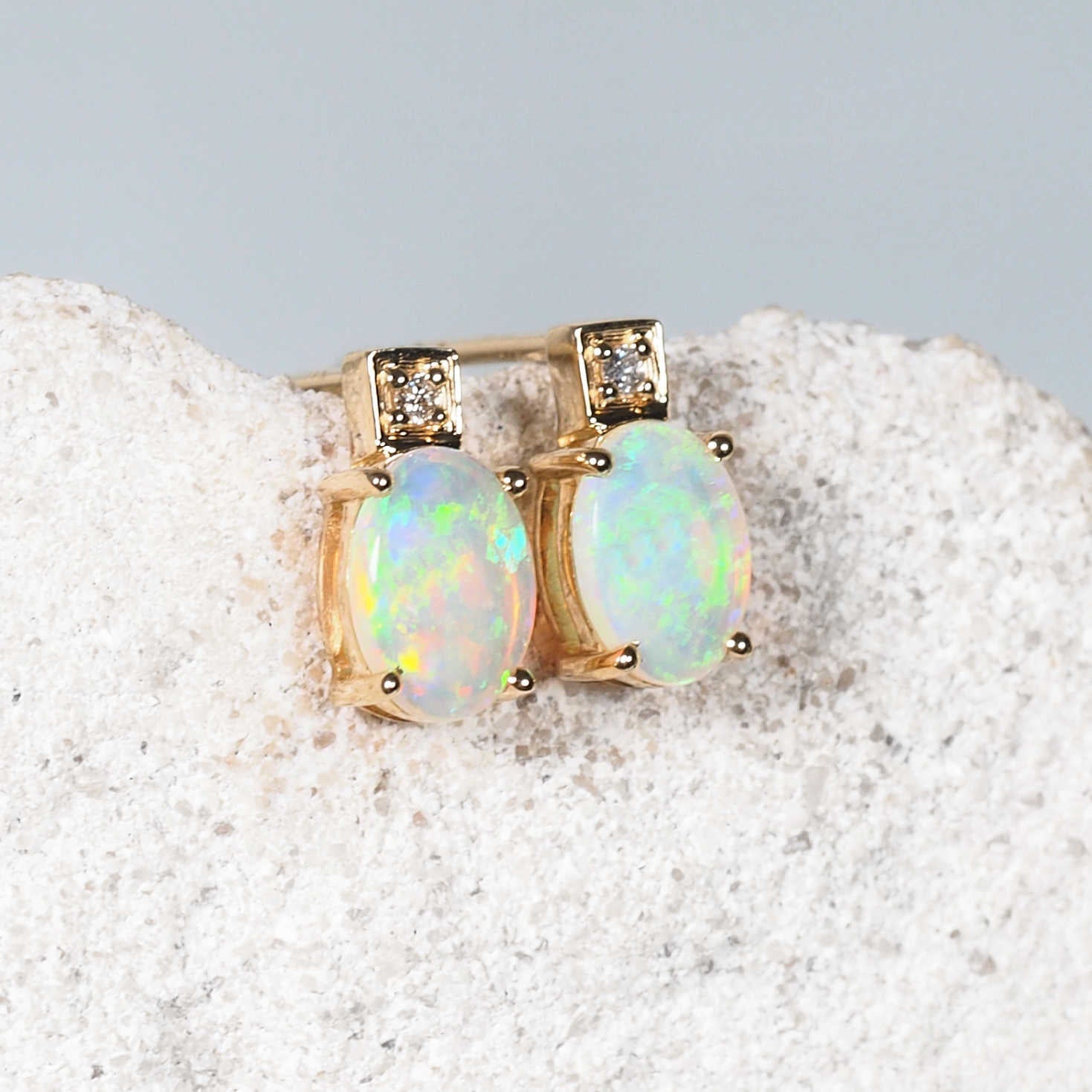 Cielo opal stud earrings in 14ct yellow gold with oval green-flashing Coober Pedy opals
