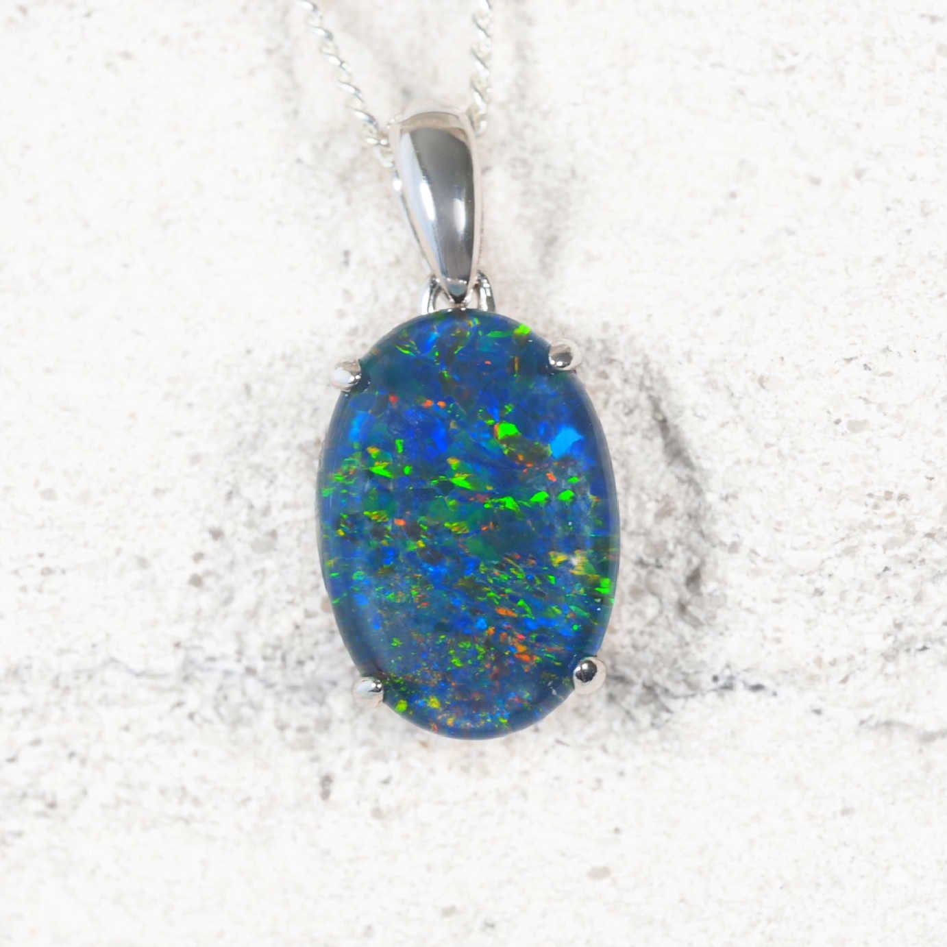 'Classic Grande' sterling silver opal pendant with claw-set oval Australian triplet opal in vivid multi-colour flashes, statement necklace design