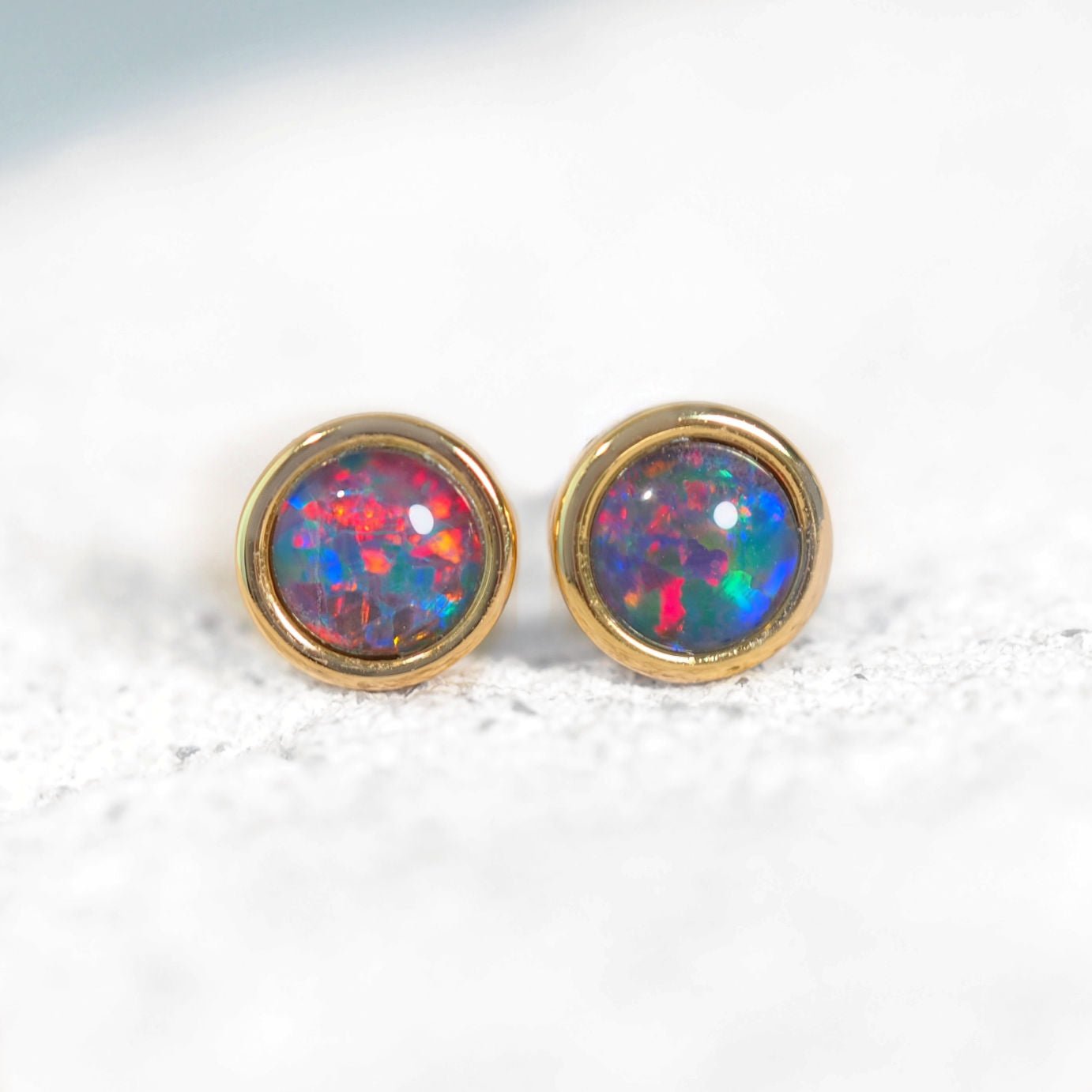 colourful opal earrings set with round australian opals